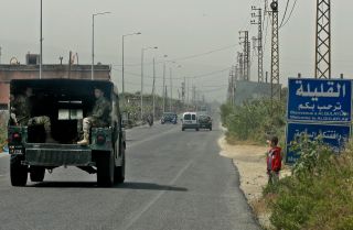 A Lebanese army vehicle patrols a road in a southern Lebanese town close to the border with Israel on April 25, 2022. 