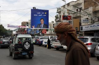 A portrait of Lebanese Information Minister George Kordahi is seen on a billboard in Sanaa, Yemen, on Oct. 31, 2021. 