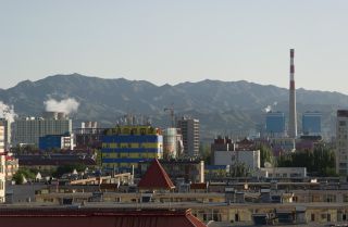 The skyline of the Inner Mongolian city of Baotou is blackened by pollution from factories processing rare earth elements, which are essential for the production of mobile phones and computers.