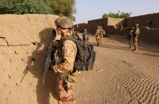 French soldiers patrol the streets in a village located in Mali’s Gao region on Dec. 4, 2021. 