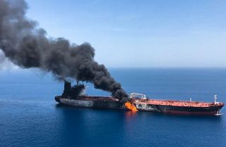 A picture from June 13 shows fire and smoke billowing from the Norwegian-owned Front Altair tanker, said to have been attacked in the waters of the Gulf of Oman.