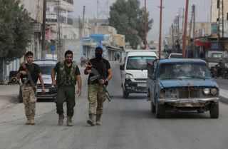 Turkish-backed fighters in the Syrian border town of Tal Abyad 