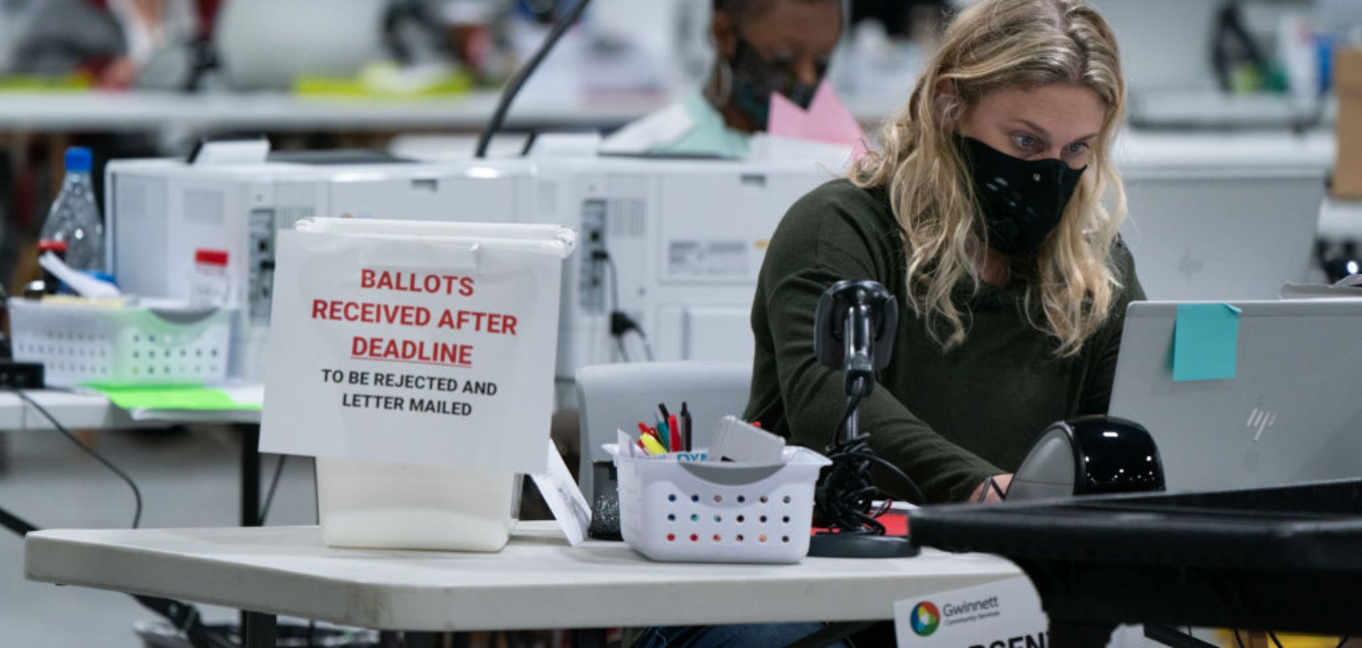 Election personnel check in provisional ballots at the Gwinnett County Board of Voter Registrations and Elections offices on Nov. 7, 2020, in Lawrenceville, Georgia.