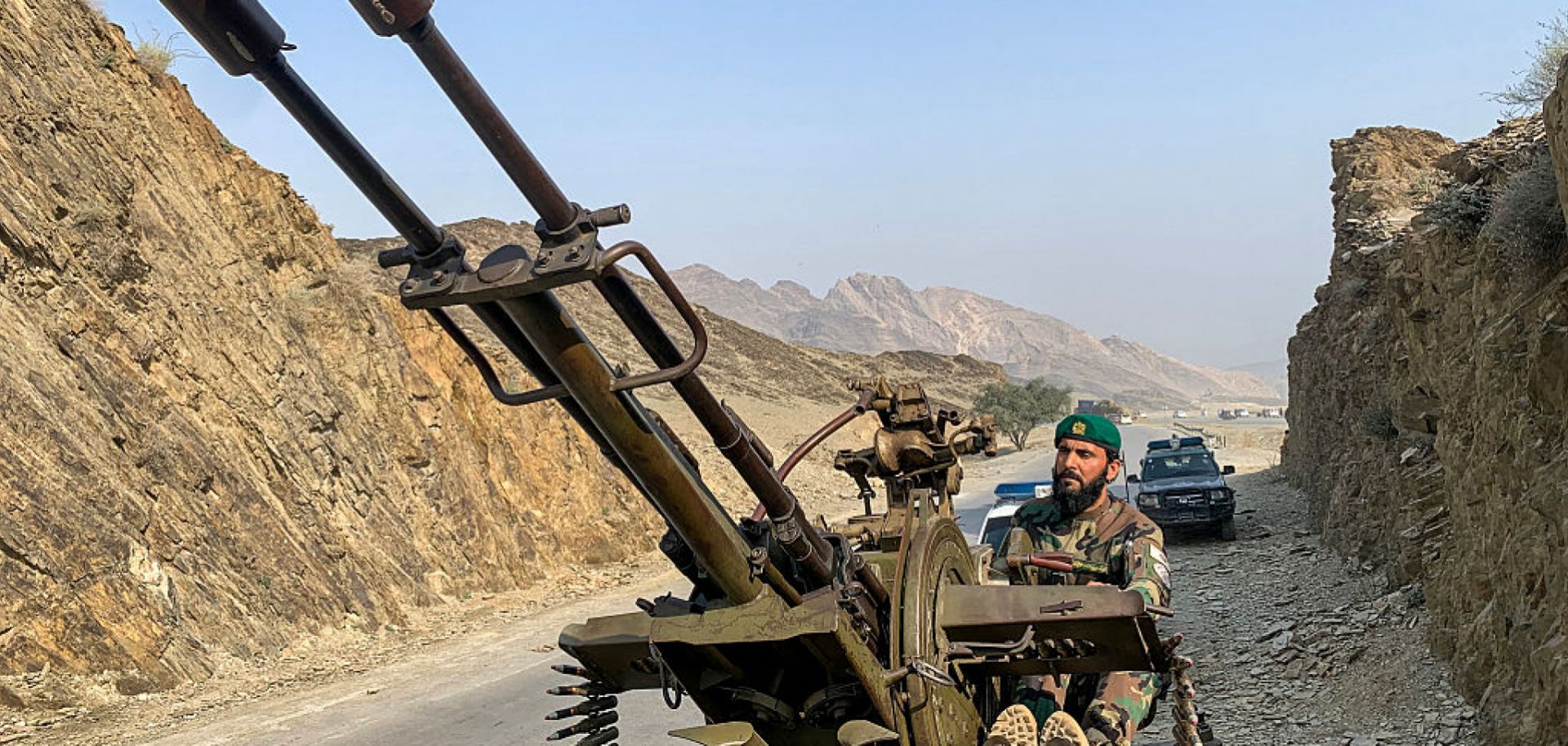A Taliban security personnel operating an anti-aircraft gun keeps watch for Pakistani airstrikes near the Torkham border crossing between Afghanistan and Pakistan on Feb. 27 in in Nangarhar province, Afghanistan.