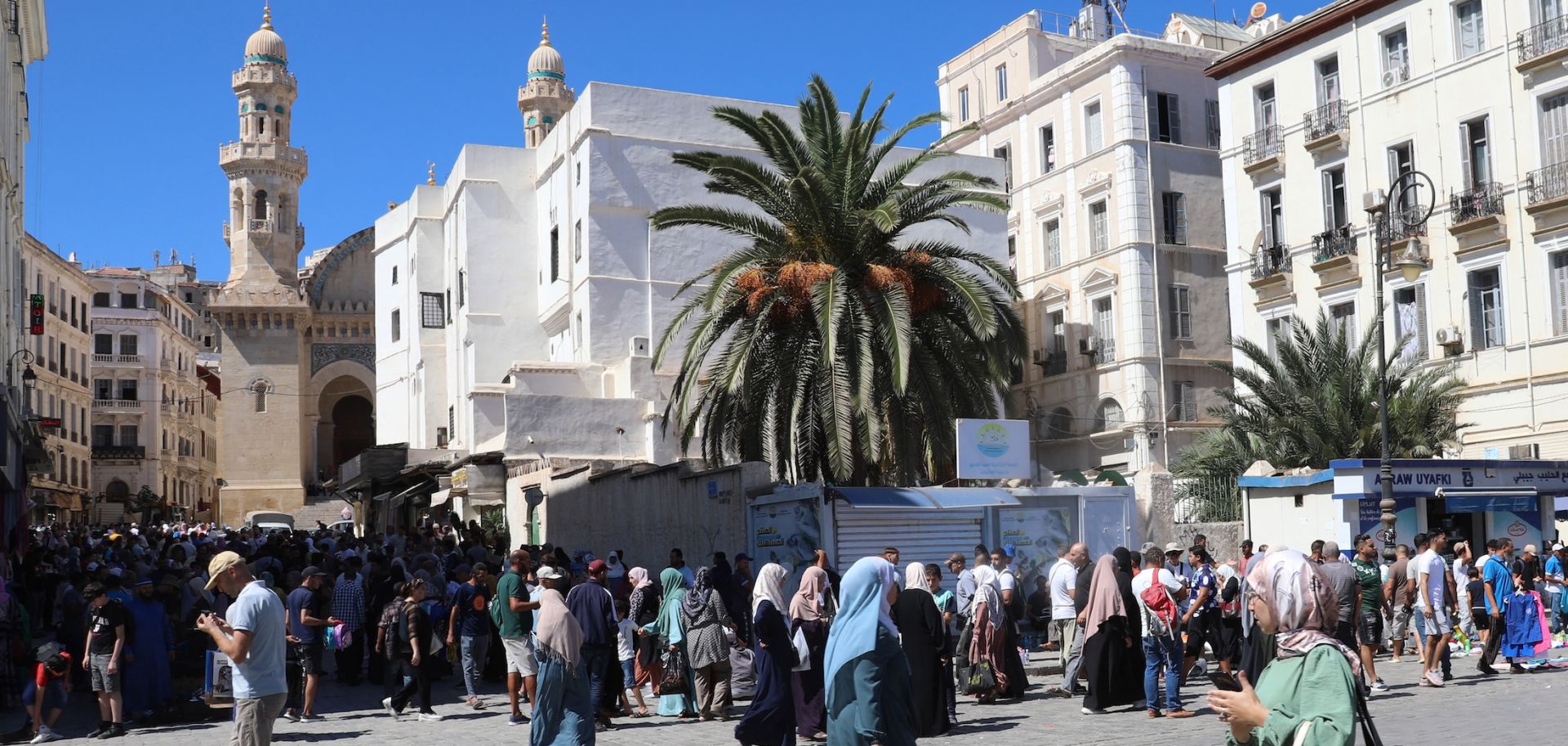 People walk through a main square in Algeria's capital of Algiers on Sept. 15, 2024.