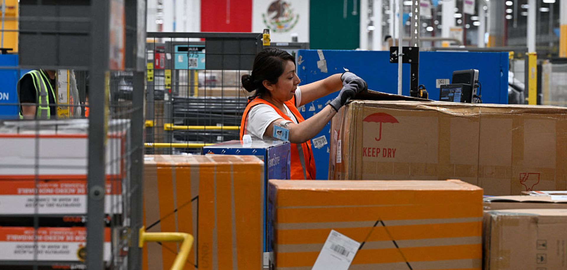 A worker prepares packages at Amazon Mex3 distribution center in Tepotzotlan, Mexico, on May 22, 2025.