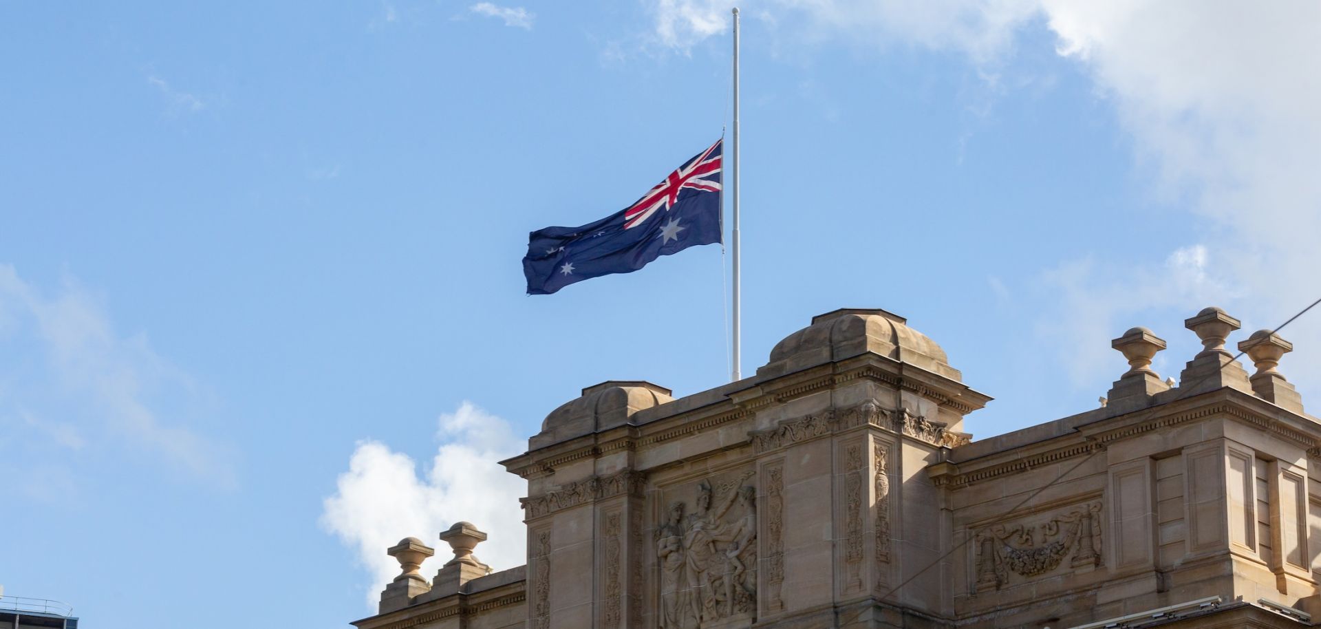 The Australian flag flies at half mast over Parliament House on Jan. 22, 2026, in Melbourne, Australia, to honor the victims of the Bondi shootings.