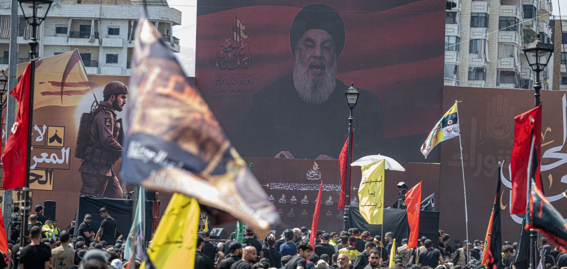 People watch a televised speech of Lebanon's Hezbollah chief Hasan Nasrallah commemorating the seventh-century killing of the Prophet Muhammad's grandson Imam Hussein, in Beirut, Lebanon, on July 17, 2024.