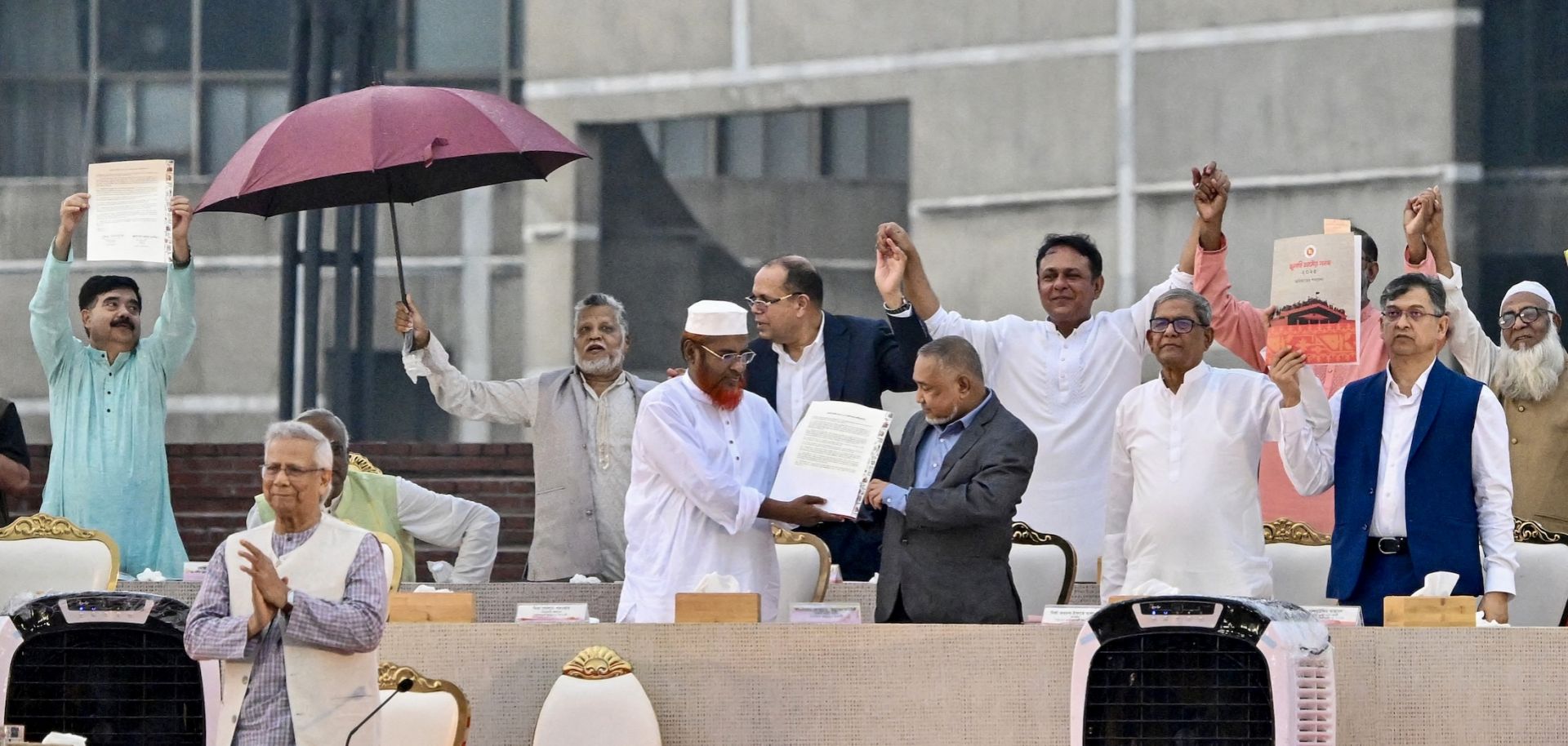 Representatives of various Bangladeshi political parties present the July National Charter at the South Plaza of the National Parliament in Dhaka on Oct. 17, 2025. 