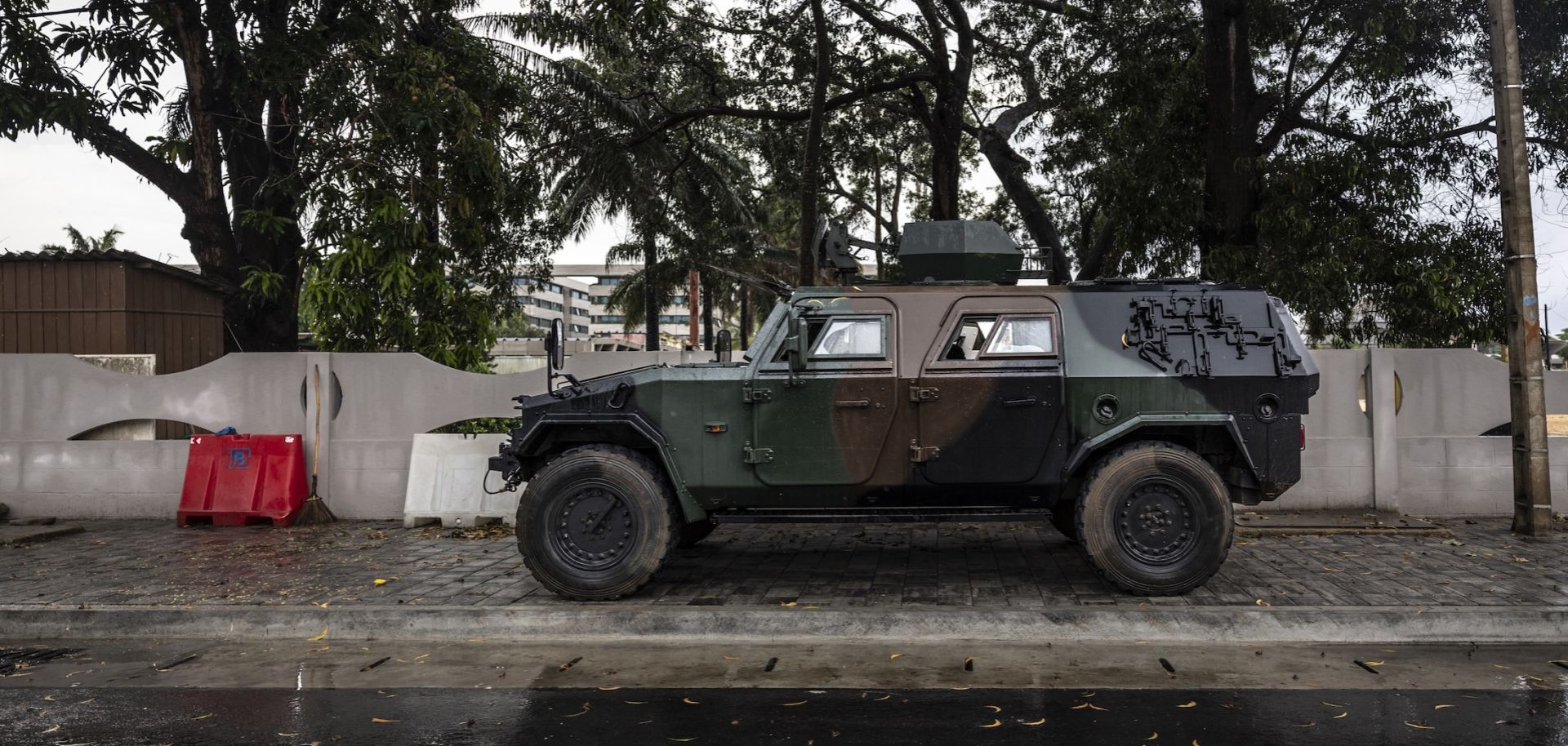 A photo taken on Dec. 8, 2025, shows an armored vehicle at the entrance of a blocked road in Cotonou, Benin, near the headquarters of the state broadcaster Benin TV.