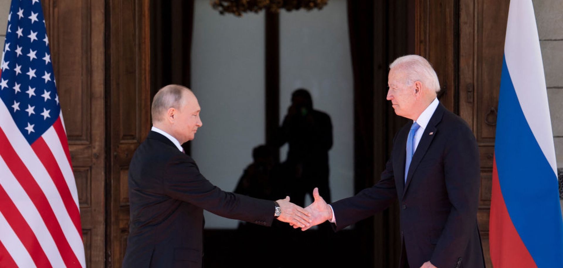 Russian President Vladimir Putin (L) shakes hands with U.S. President Joe Biden on June 16, 2021, at a summit at the Villa La Grange, in Geneva.