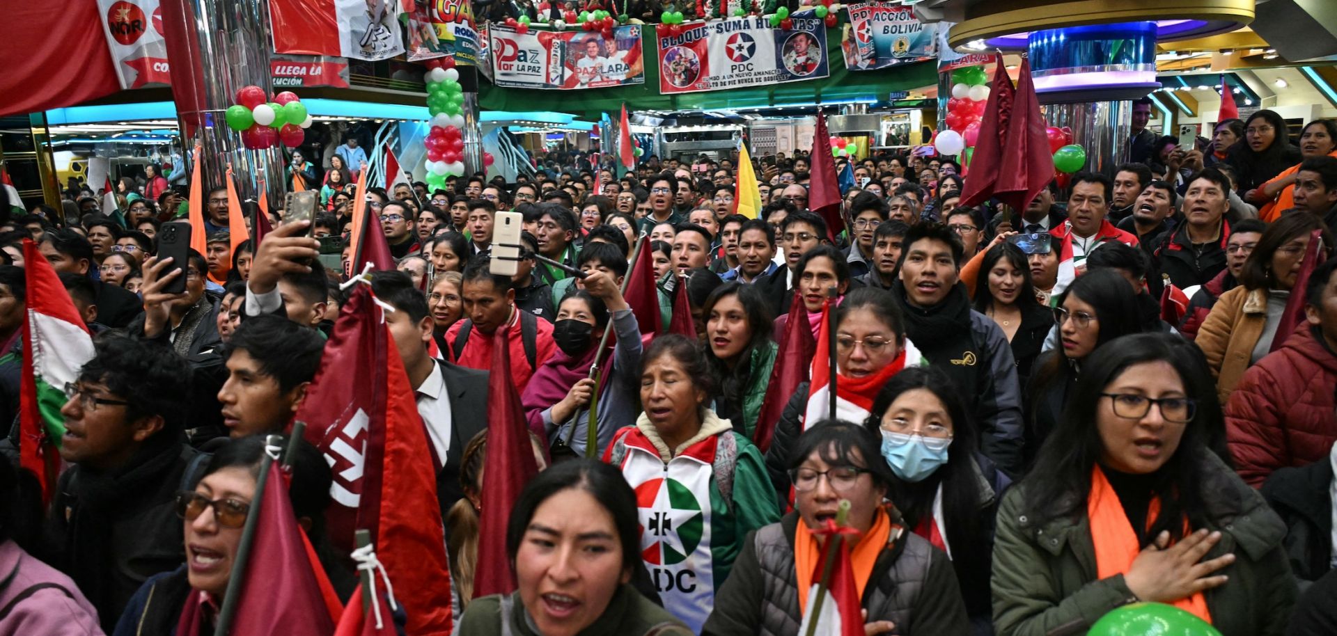 Supporters of Bolivia's presidential candidate for the Christian Democratic Party (PDC), Rodrigo Paz, listen to him speak during a campaign rally in El Alto, Bolivia, on Sept. 30, 2025. 