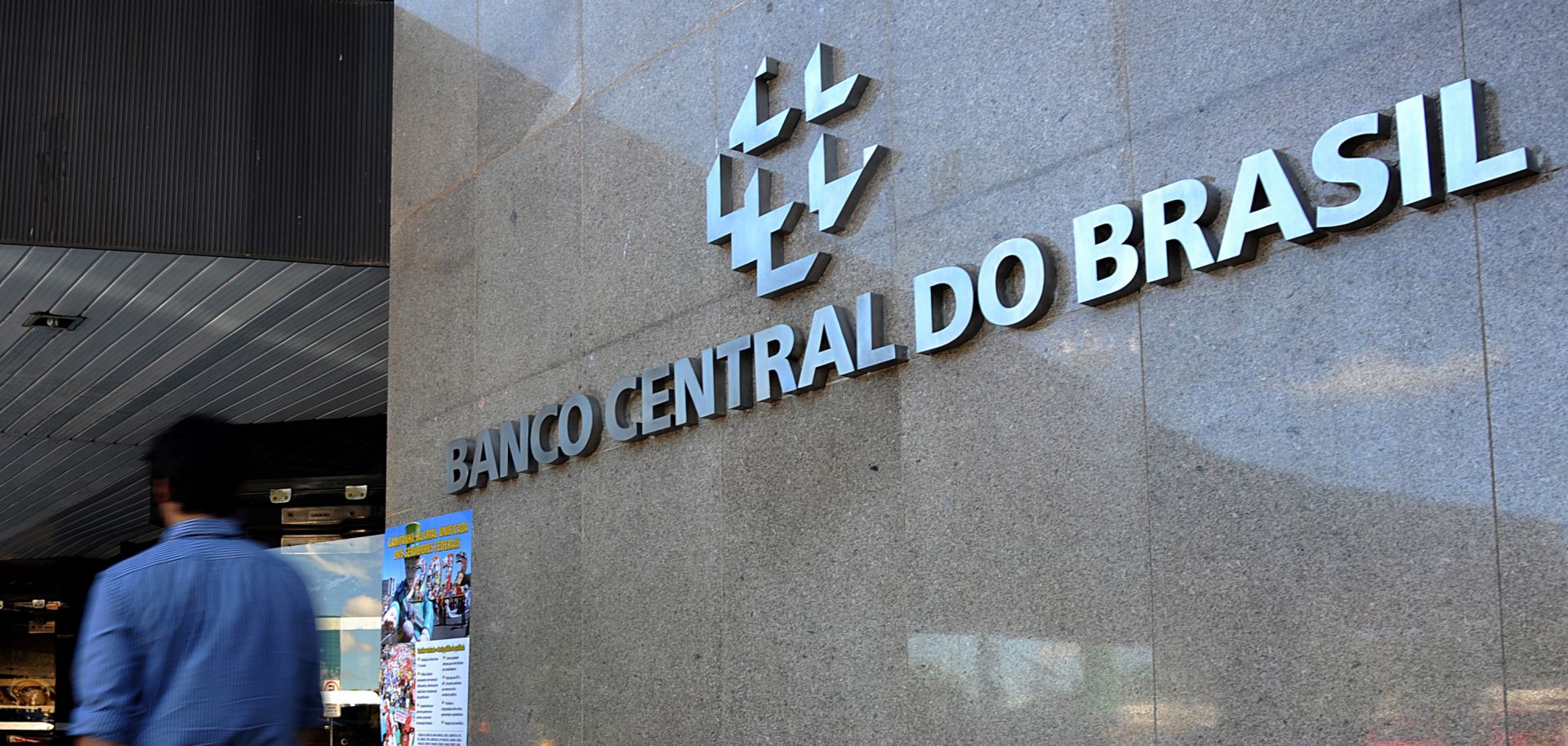 A man walks past the building of Brazil’s central bank in the capital of Brasilia on May 29, 2012.