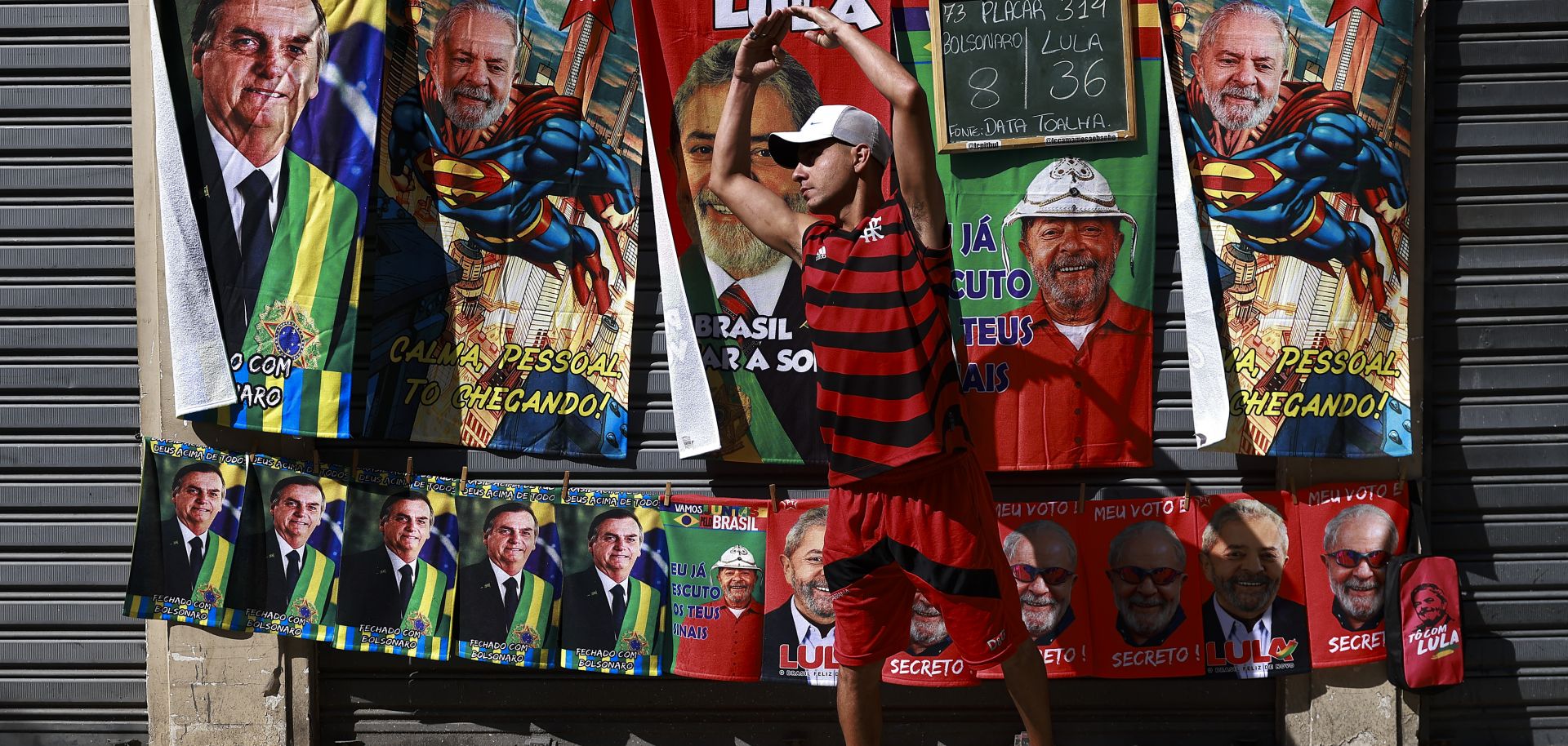 Street vendors offer towels depicting presidential candidates Lula Da Silva and Jair Bolsonaro on Sept. 24, 2022, in downtown Rio de Janeiro.