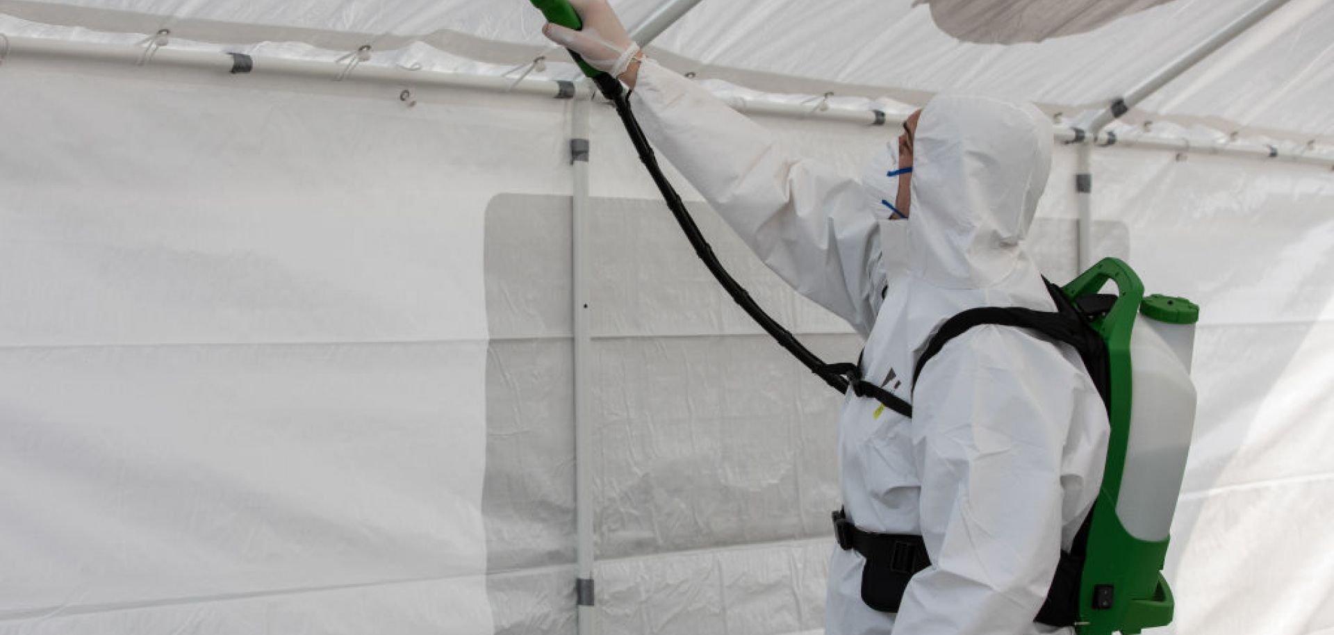 A worker disinfects a field hospital for COVID-19 patients March 20, 2020, in Cremona, Italy.