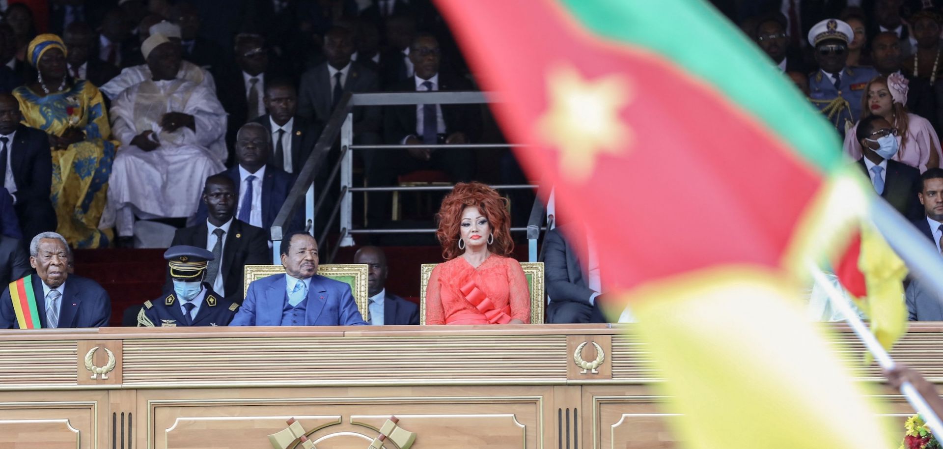 Cameroon President Paul Biya (L) and his wife Chantal Biya react during a parade marking the 51st celebration of Unity Day in Yaounde on May 20, 2023.