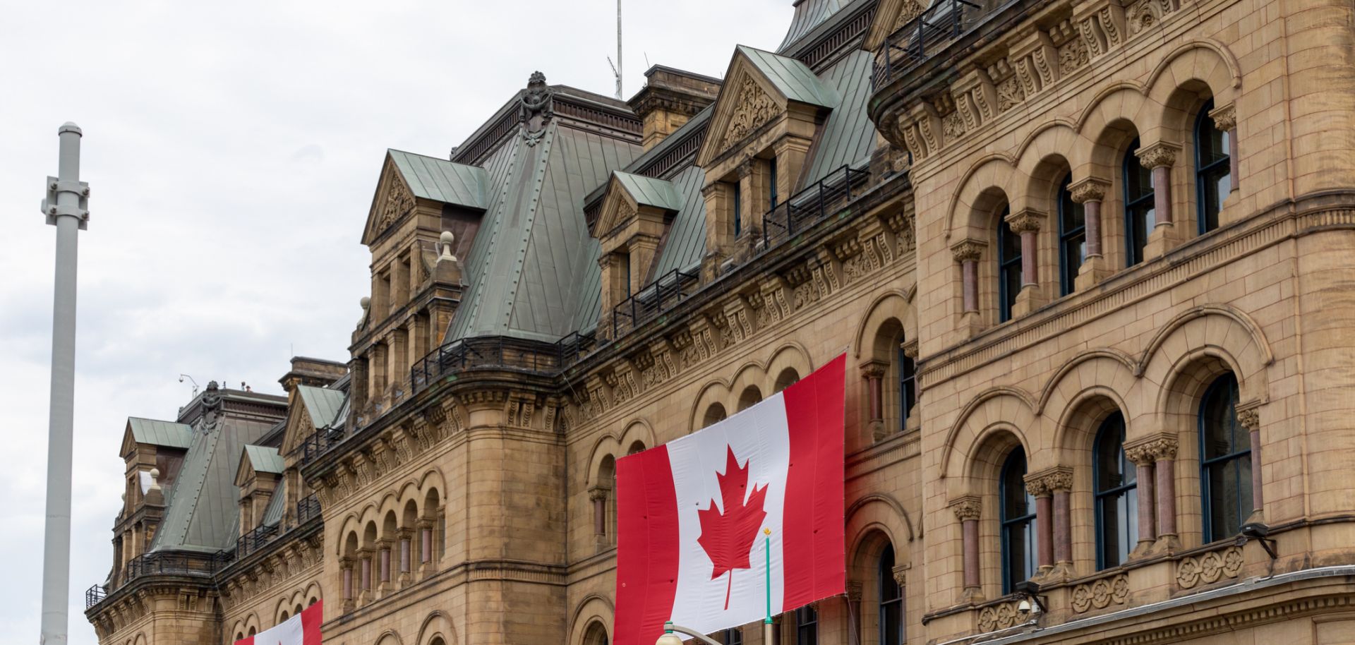 Canadian flags are seen outside a building in Ottawa. 