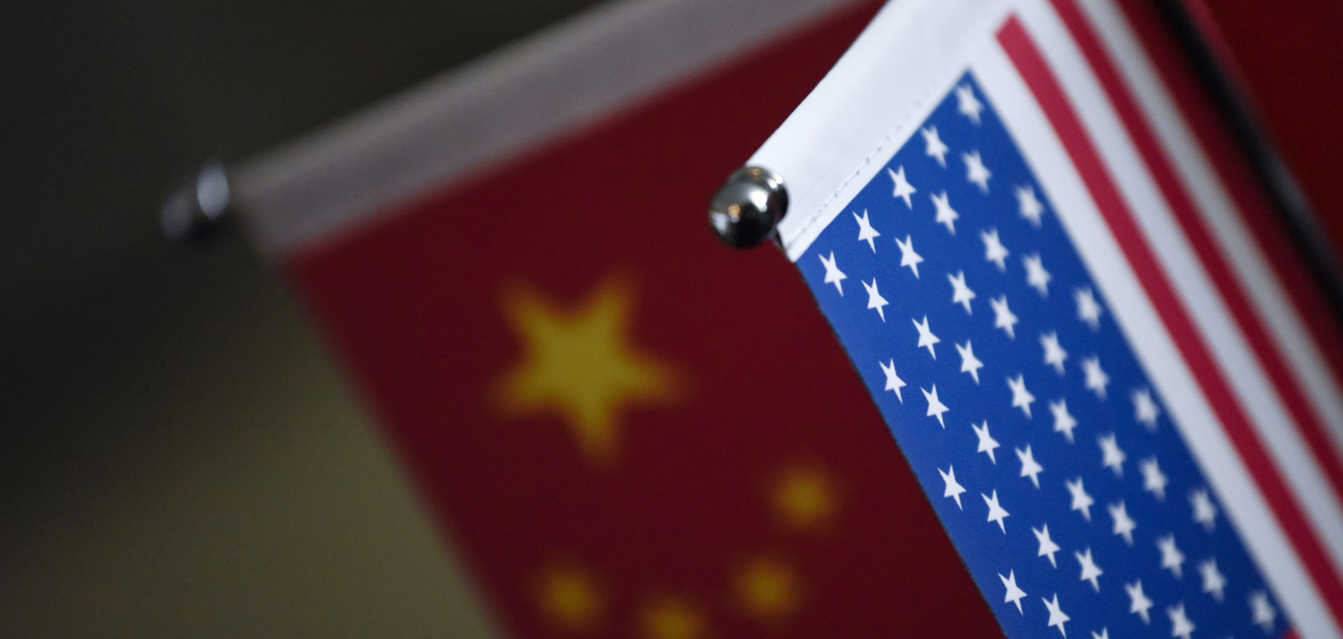 Chinese flags and American flags are displayed at a business in Beijing. 