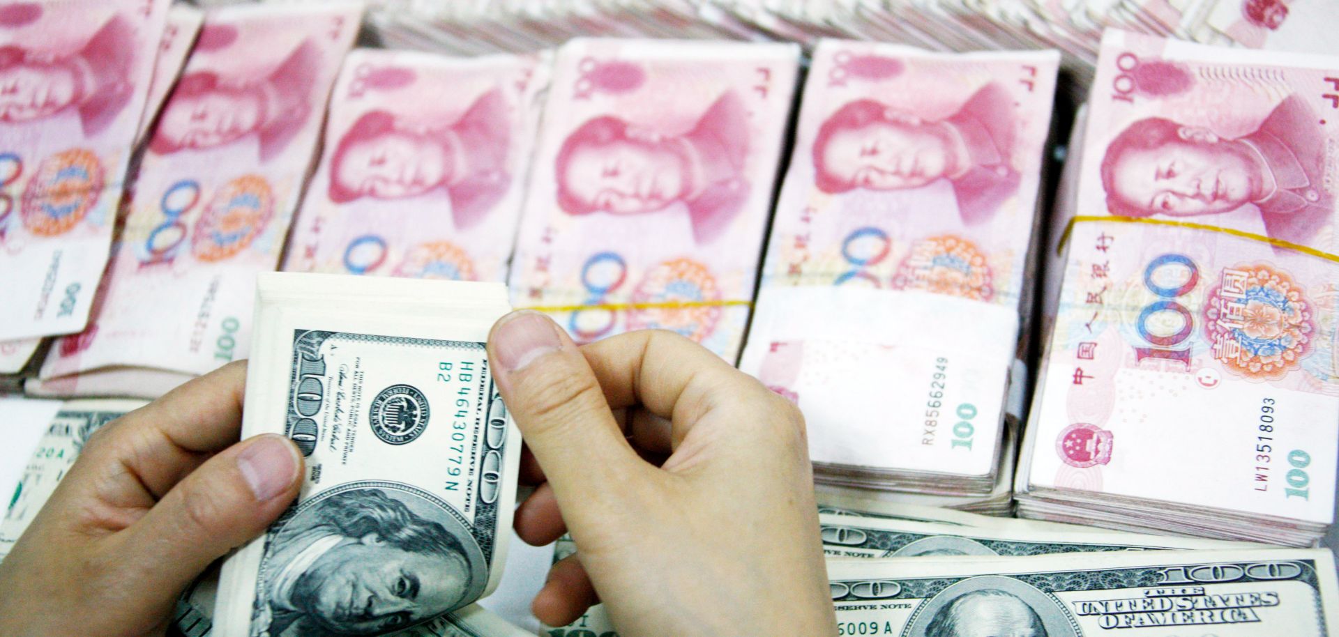 An employee counts money at a branch of Industrial and Commercial Bank of China on July 26, 2011 in Huaibei, Anhui province, China.