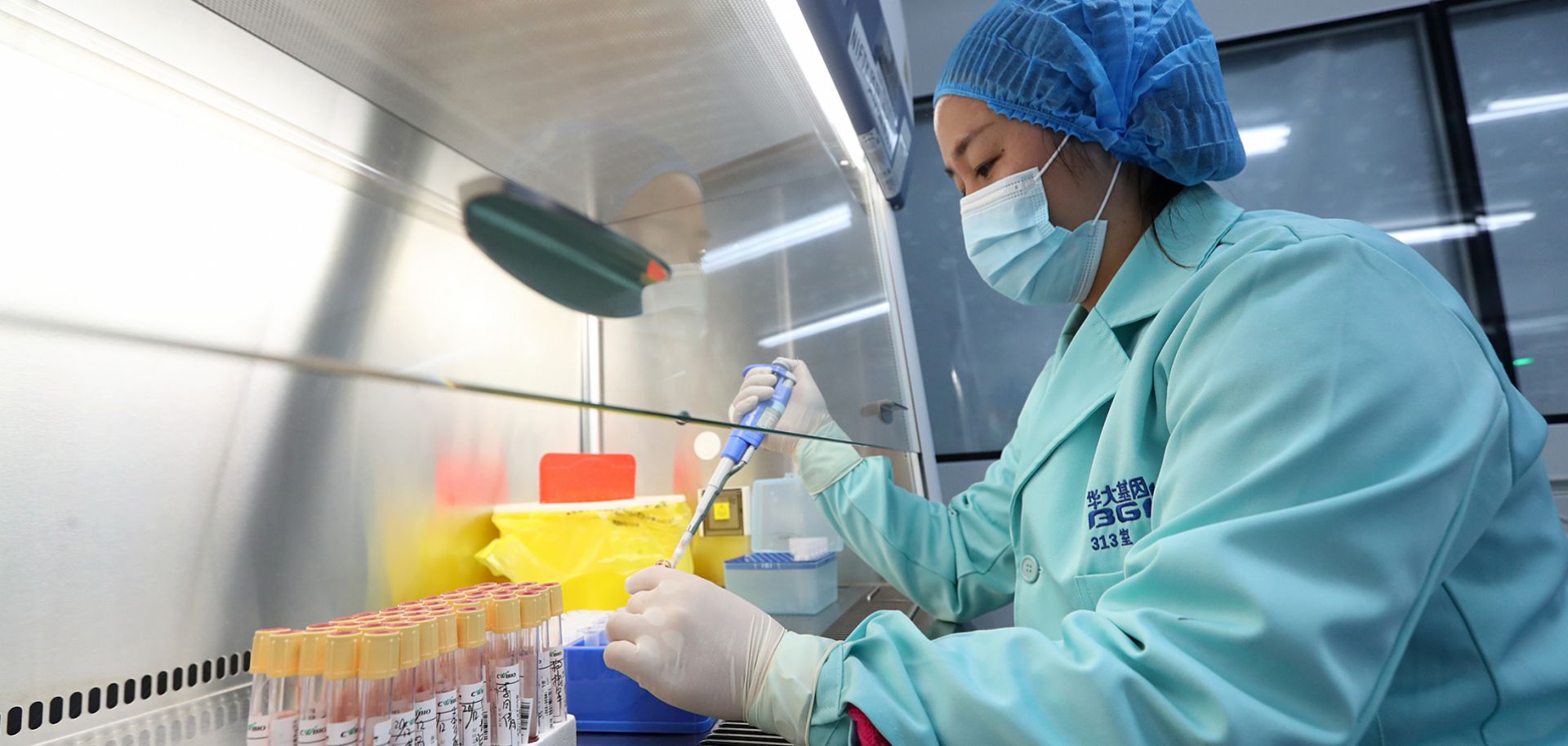 This Dec. 26, 2018, photo shows a researcher working in a Beijing Genomics Institute laboratory in Kunming, China.