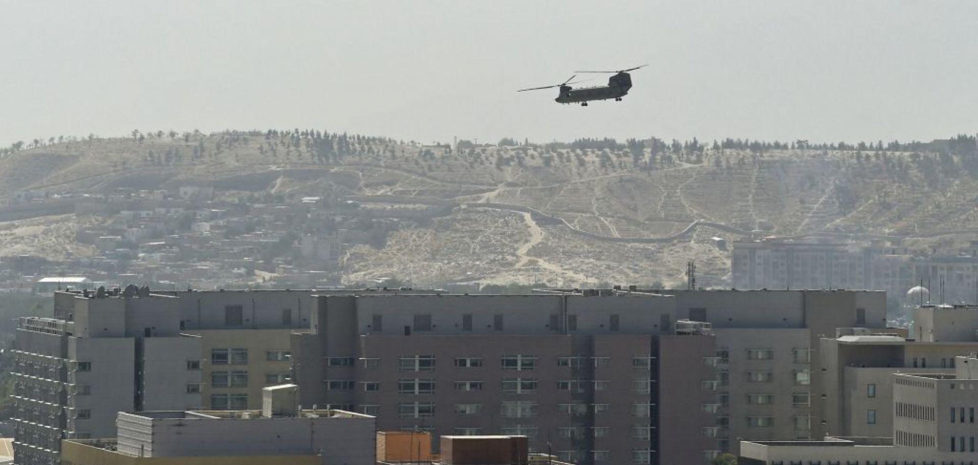 A U.S. military helicopter Aug. 15, 2021, above the U.S. Embassy in Kabul, Afghanistan.