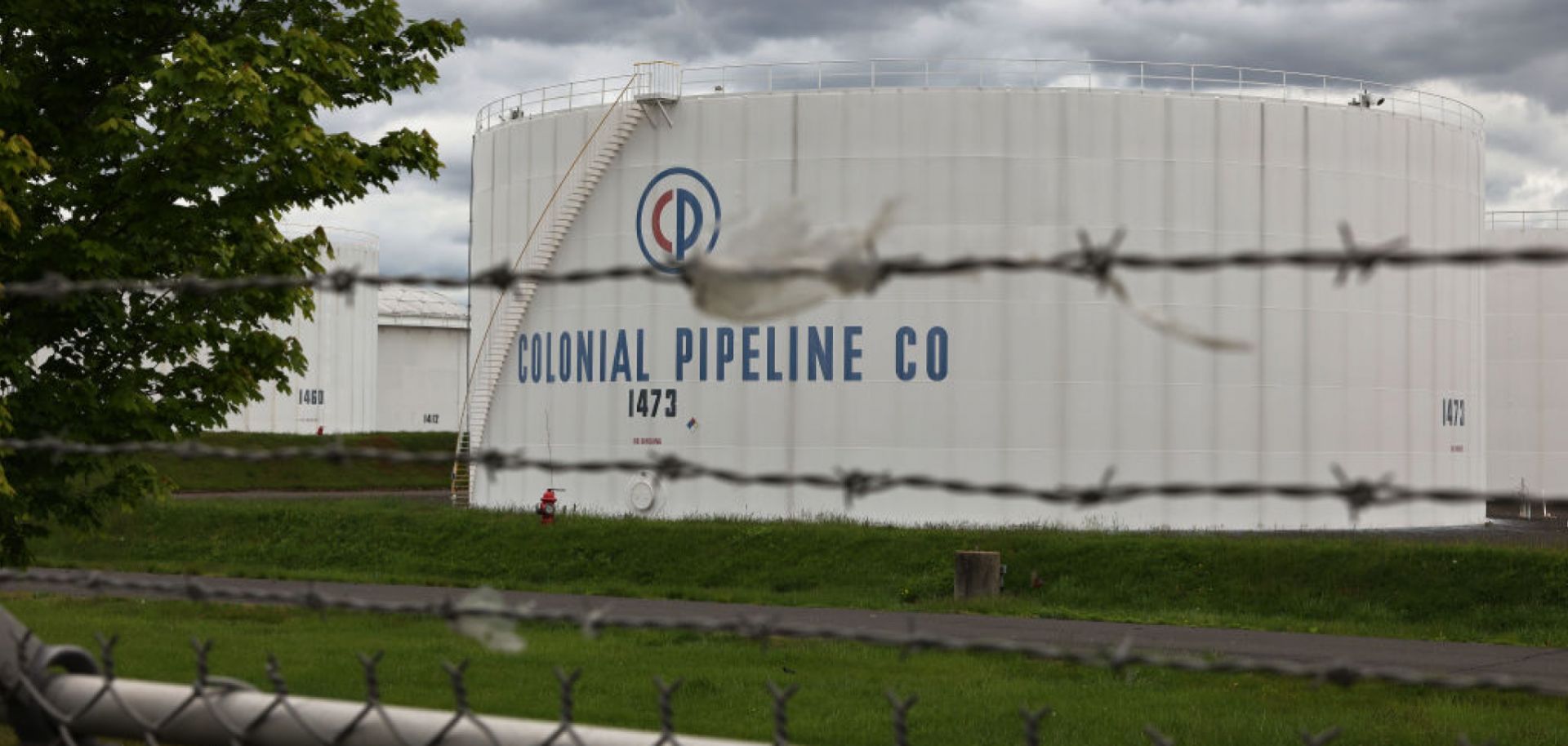 Fuel holding tanks are seen at Colonial Pipeline's Linden Junction Tank Farm in Woodbridge, New Jersey, on May 10, 2021.