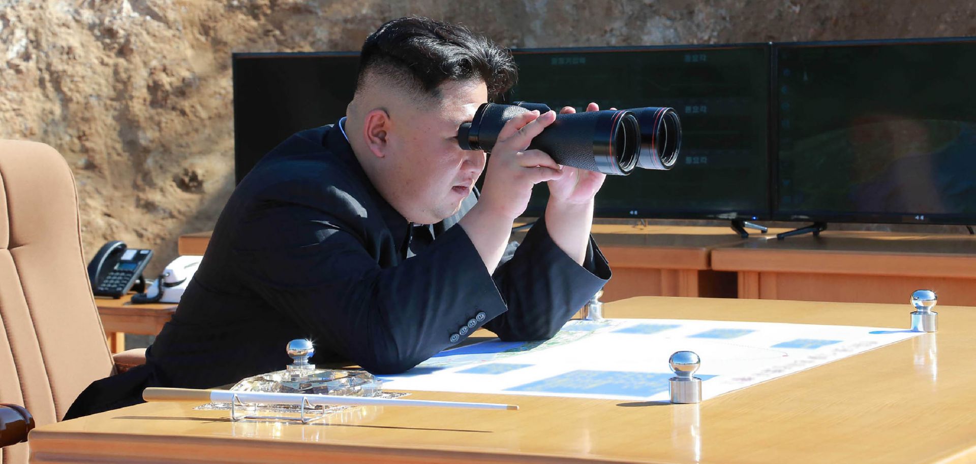 A photo released by North Korean media shows leader Kim Jong Un watching a missile test in July 2017. 