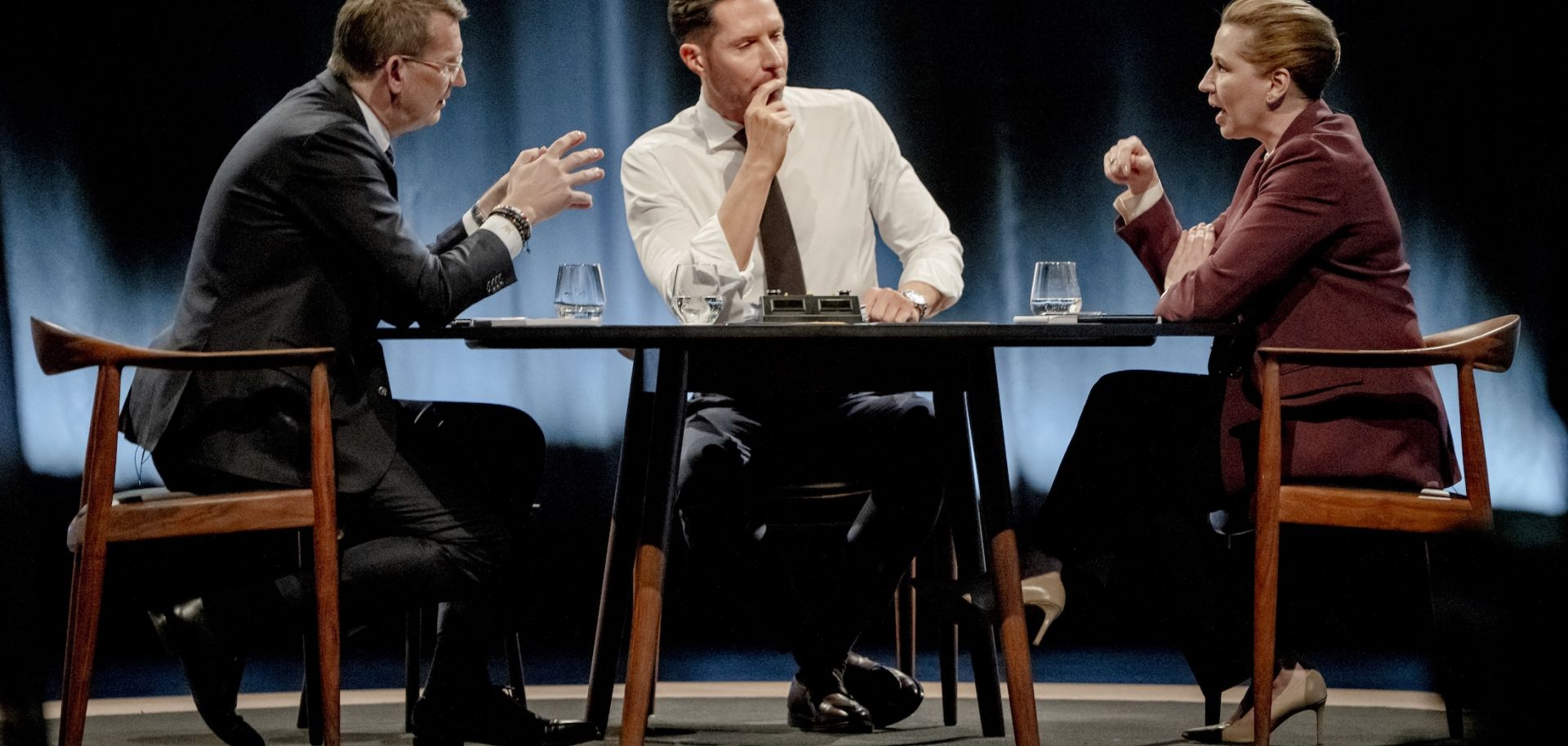 Danish Defense Minister and top candidate of Denmark's Venstre party, Troels Lund Poulsen (left), and Danish Prime Minister and top candidate of the Social Democrat Party, Mette Frederiksen (right), attend a debate in Copenhagen on March 15, 2026.