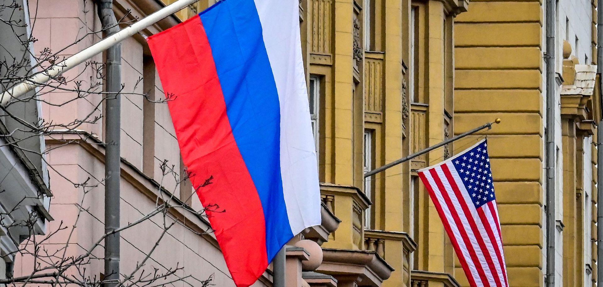 A Russian flag flies next to the U.S. Embassy building in Moscow, Russia, on March 18, 2021.