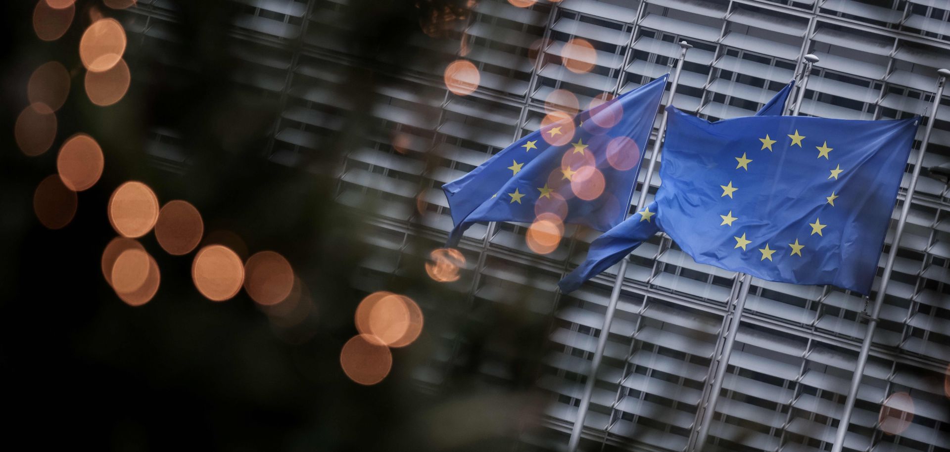 EU flags fly outside the European Commission building in Brussels on Dec. 7, 2020.