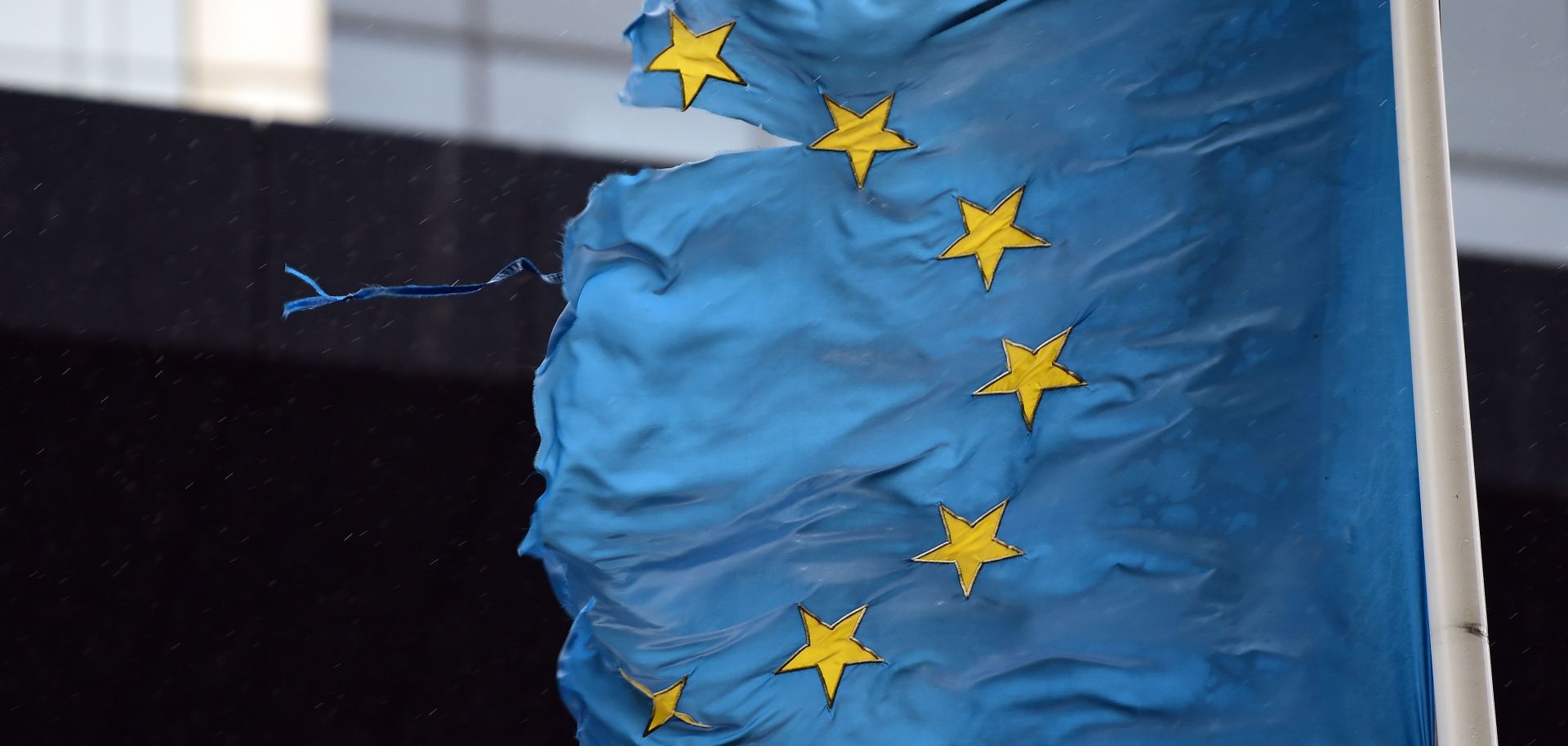 A shredded EU flag flutters in the wind on March 1, 2016, in Brussels, Belgium. 