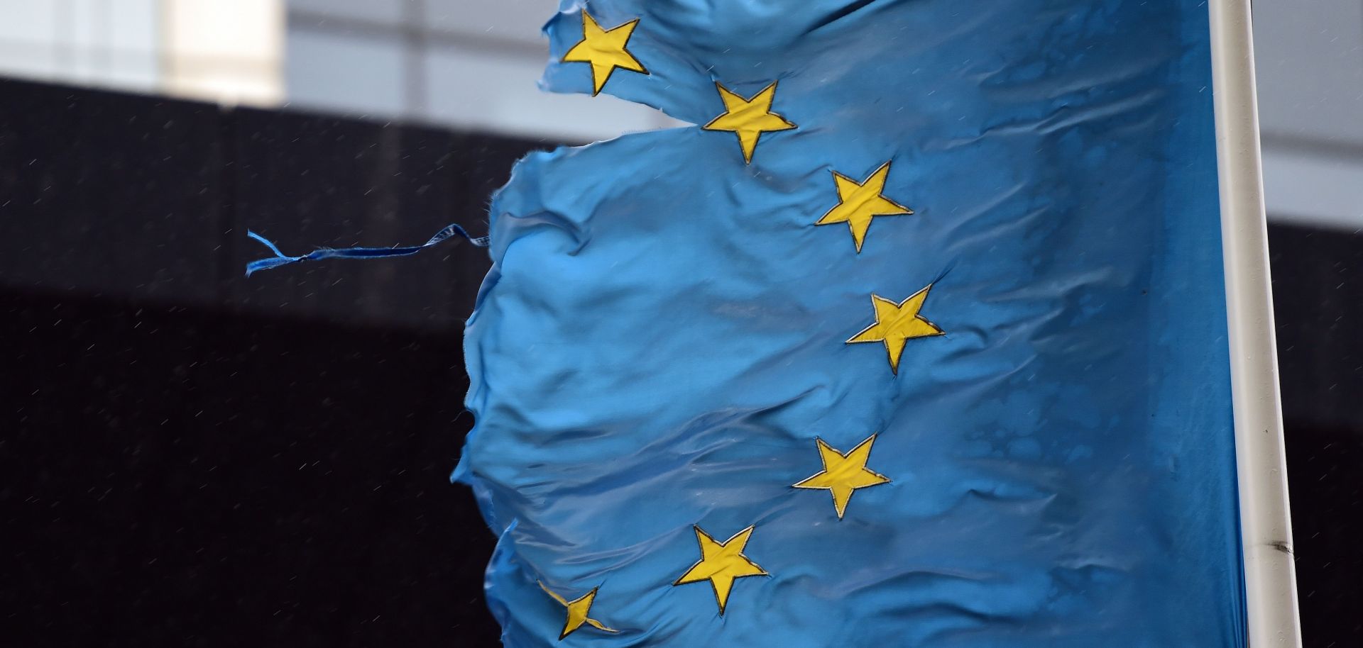 A shredded EU flag flutters in the wind on March 1, 2016, in Brussels, Belgium.