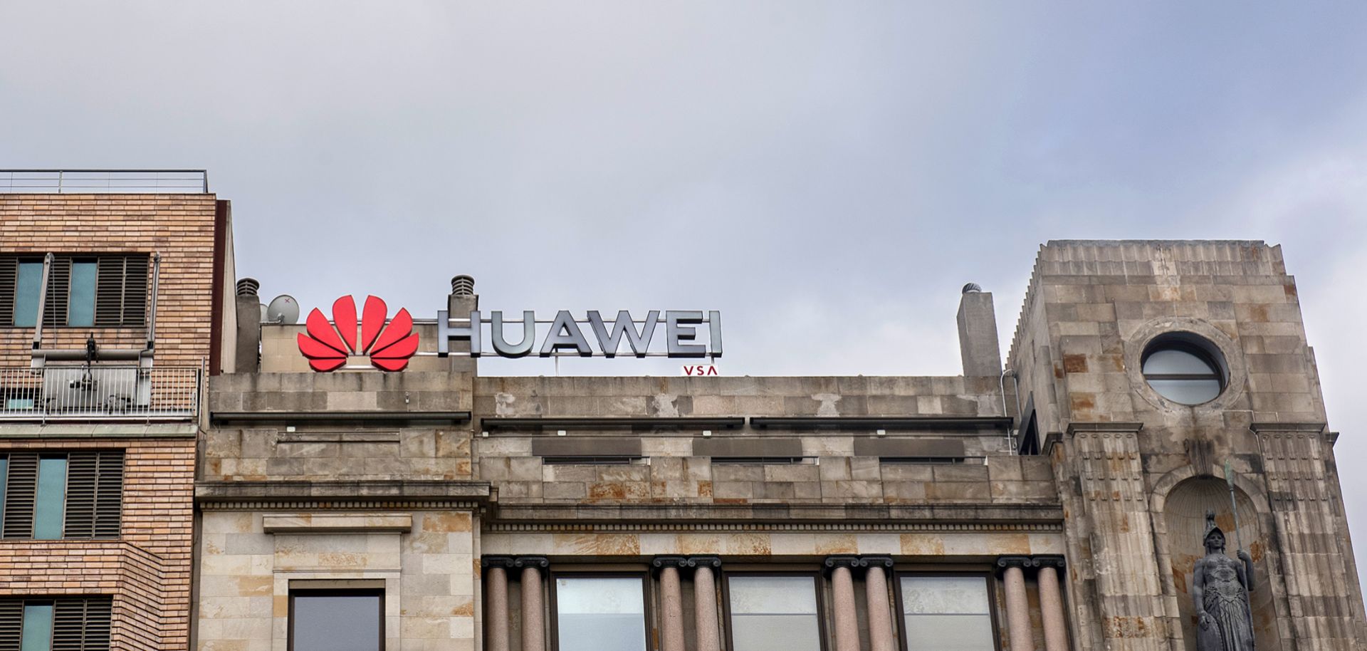 A Huawei logo looms over a street in Barcelona, Spain.