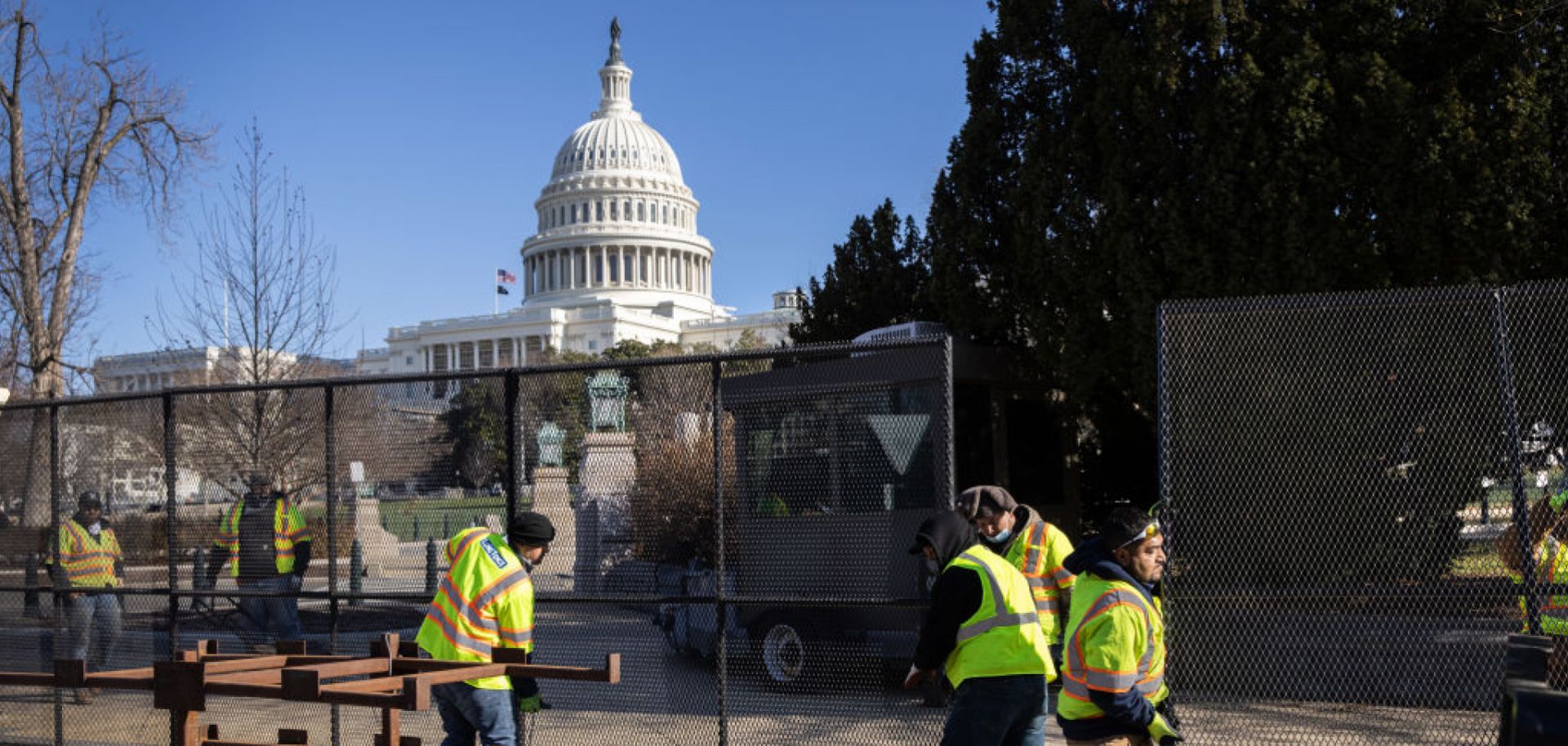 Workers build a fence around the U.S. Capitol on Jan. 7, 2021, in Washington, the day after supporters of U.S. President Donald Trump stormed the building.