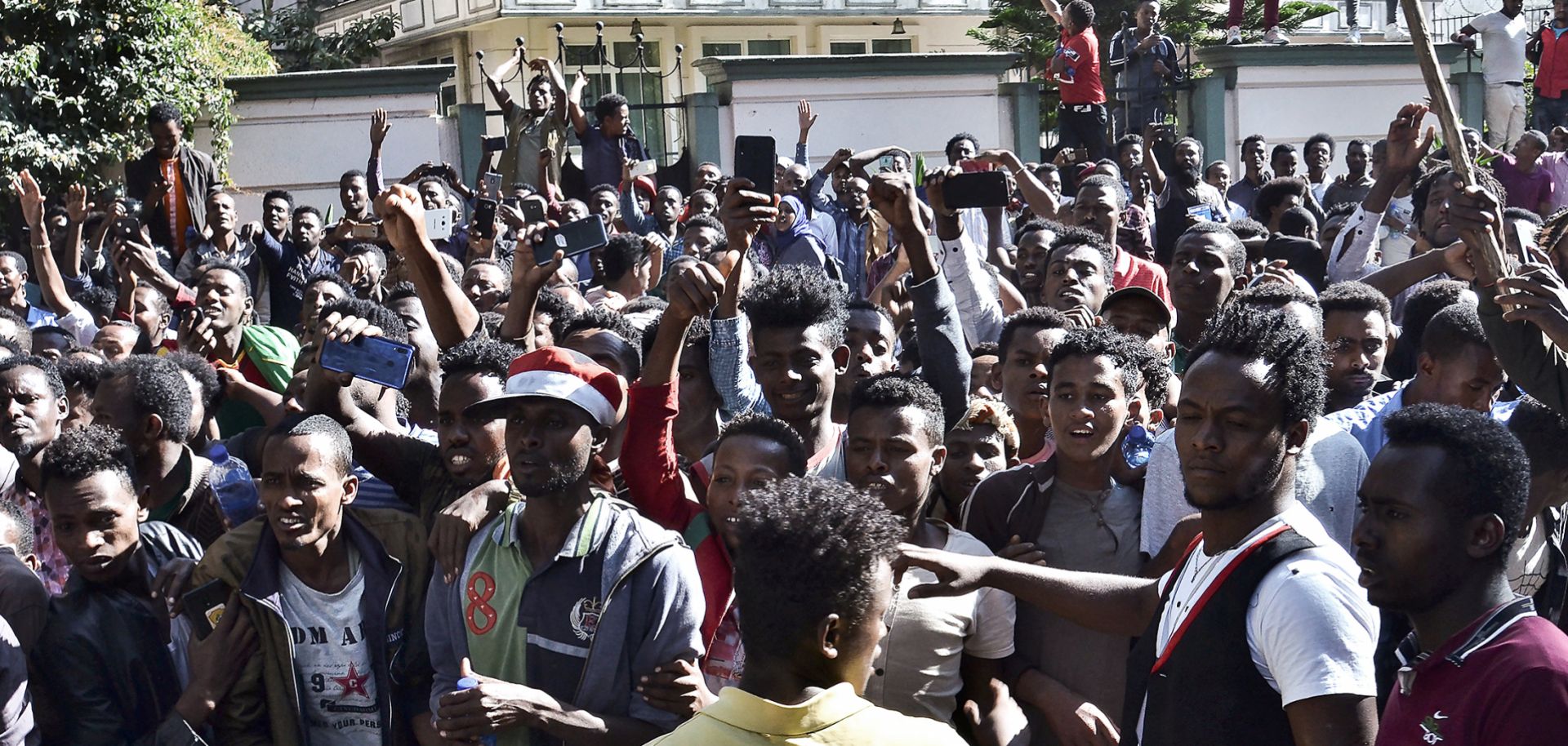 Supporters of Jawar Mohammed, a member of the Oromo ethnic group and high-profile opposition activist, gather outside Ethiopian Prime Minister Abiy Ahmed's home following rumors that his security forces had tried to orchestrate an attack against Mohammed. 