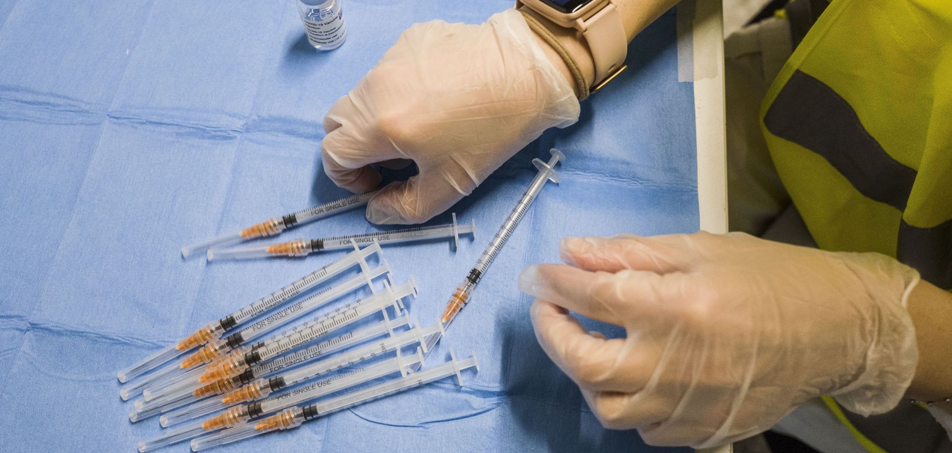 A worker prepares doses of the AstraZeneca COVID-19 vaccine at a distribution site in Rome, Italy, on May 15, 2021.