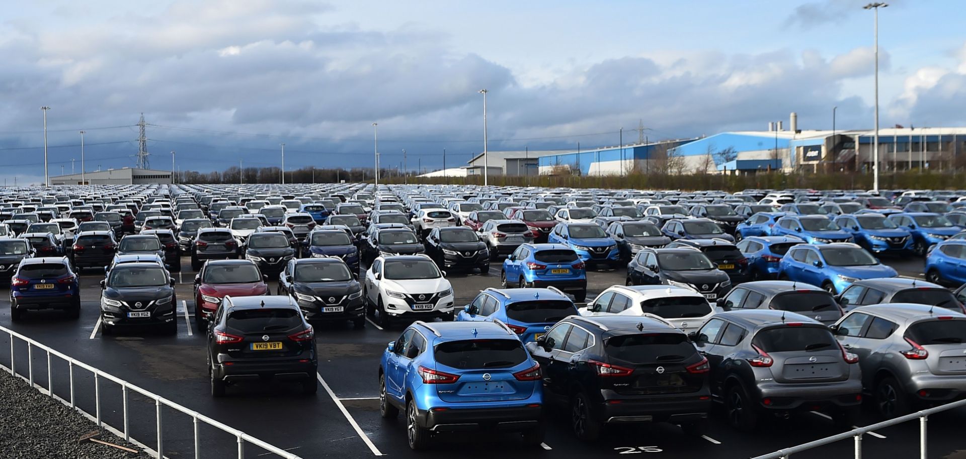 Nissan cars are pictured, parked in a lot at its' Sunderland plant in north east England on March 16, 2019. 