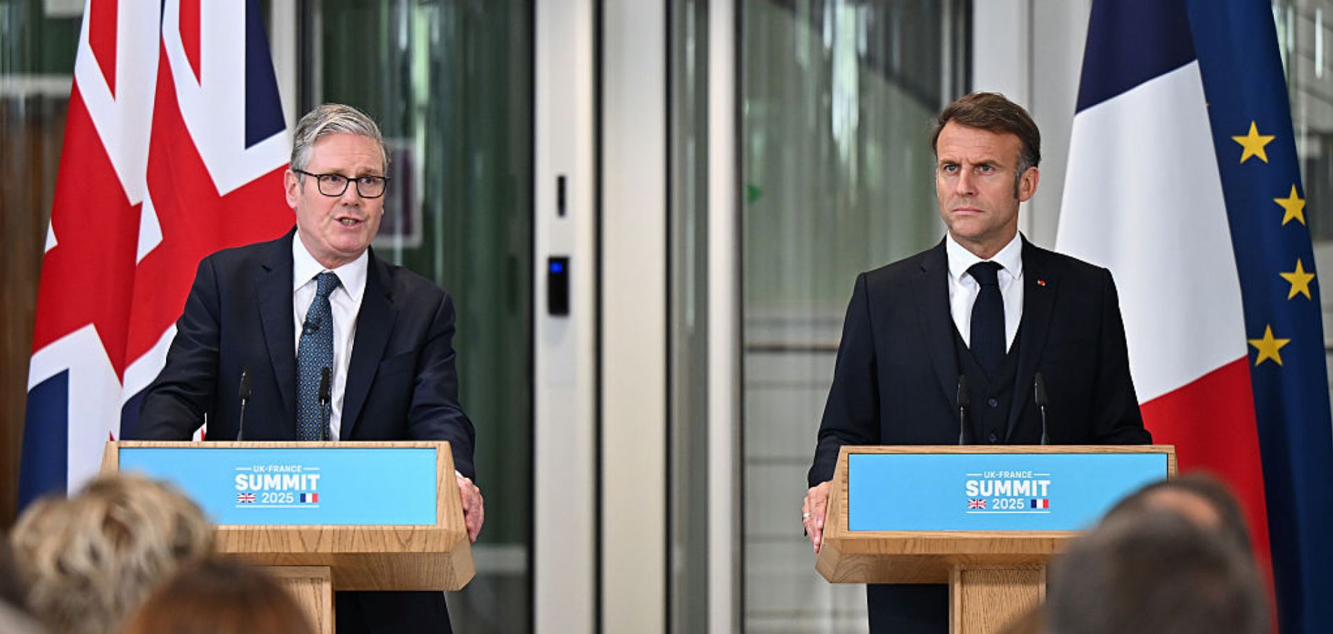U.K. Prime Minister Keir Starmer (L) and French President Emmanuel Macron hold a press conference on July 10, 2025, in London.