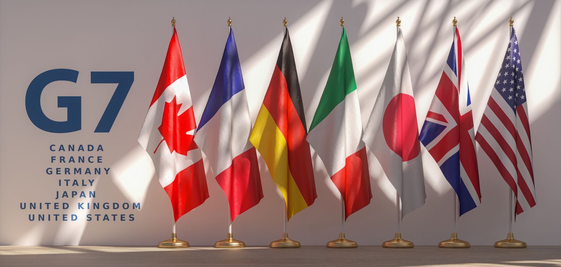 An image shows a row of flags from the G7 members. 