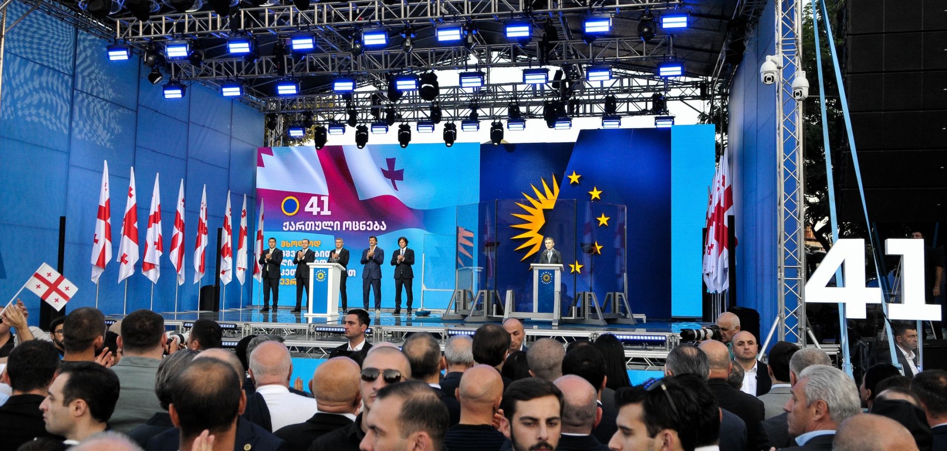 The founder of the Georgian Dream party, Bidzina Ivanishvili, stands behind the bulletproof glass as he gives a campaign speech in Gori, Georgia, on Sept. 14, 2024.