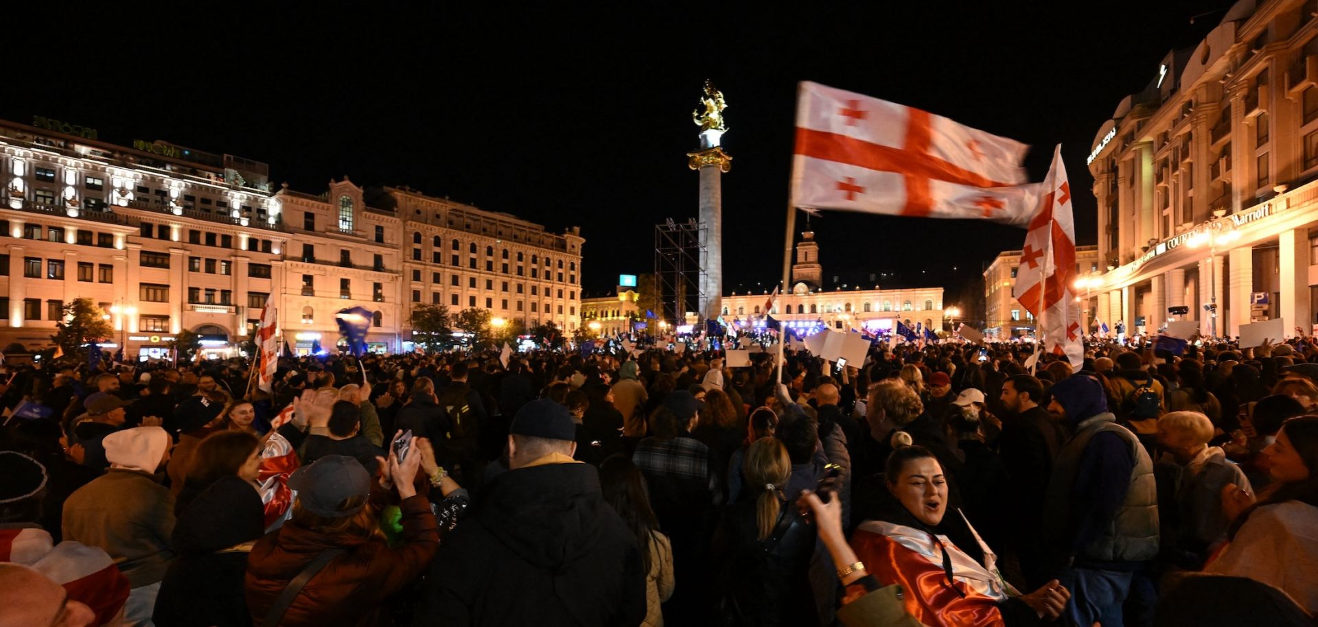 Protesters hold Georgian flags during a pro-Europe rally in Tbilisi ahead of Georgia's parliamentary elections on Oct. 20, 2024. 