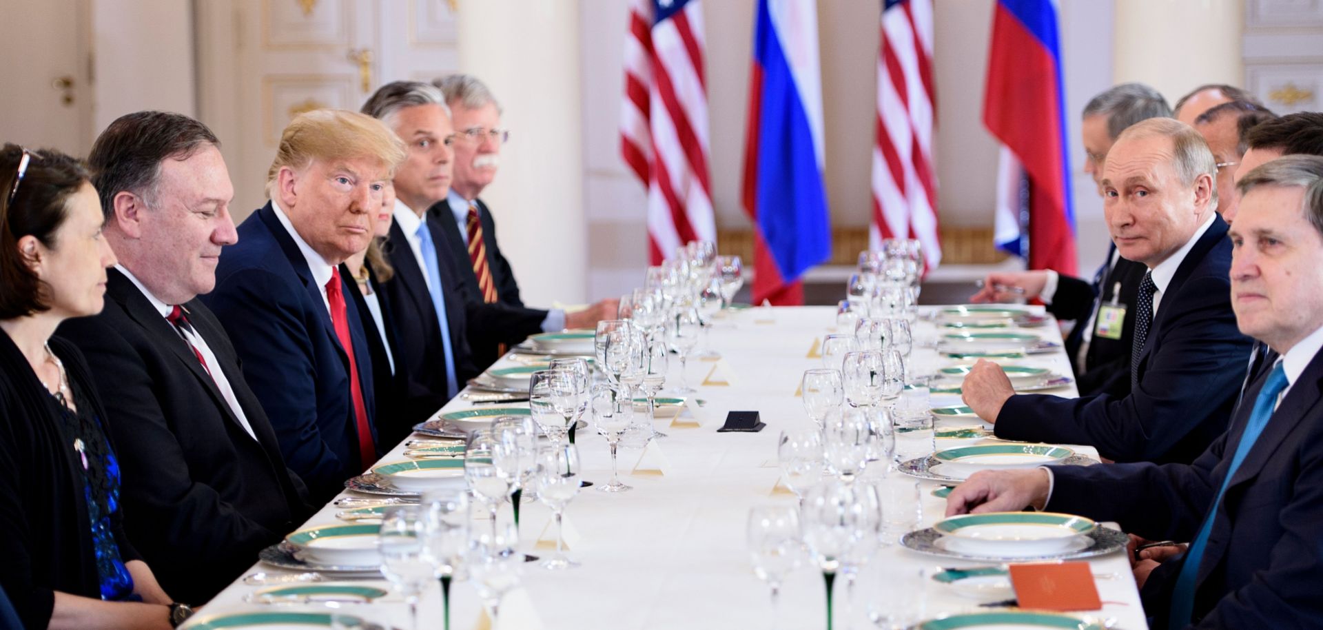 U.S. President Donald Trump (3L), Russian President Vladimir Putin (2R) and others wait for a working lunch meeting at Finland's Presidential Palace on July 16, 2018 in Helsinki. Key topics of their meeting will include sanctions, arms control, and the conflicts in Ukraine and Syria.