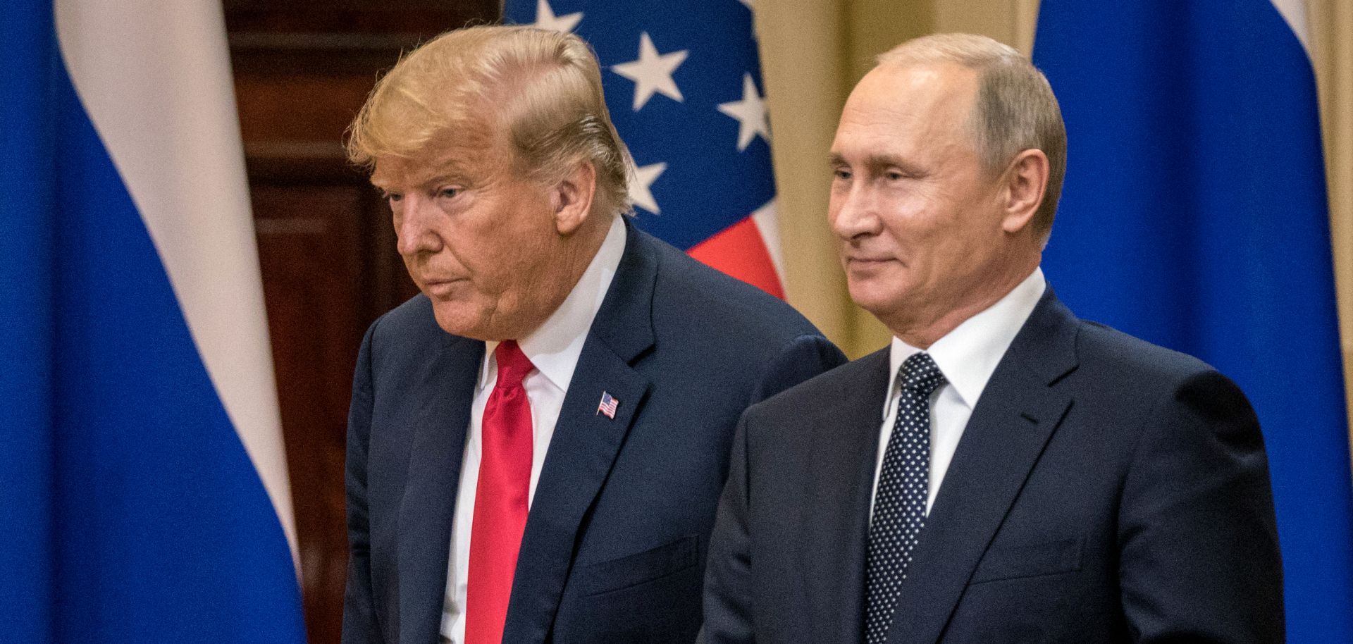 U.S. President Donald Trump (left) and Russian President Vladimir Putin arrive at a press conference after their summit on July 16, 2018, in Helsinki, Finland.