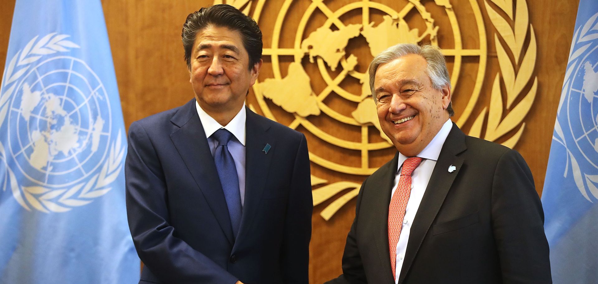 Then-Japanese Prime Minister Shinzo Abe shakes hands with the Secretary-General of the United Nations in New York City during the 73rd U.N. General Assembly on Sept. 25, 2018. 