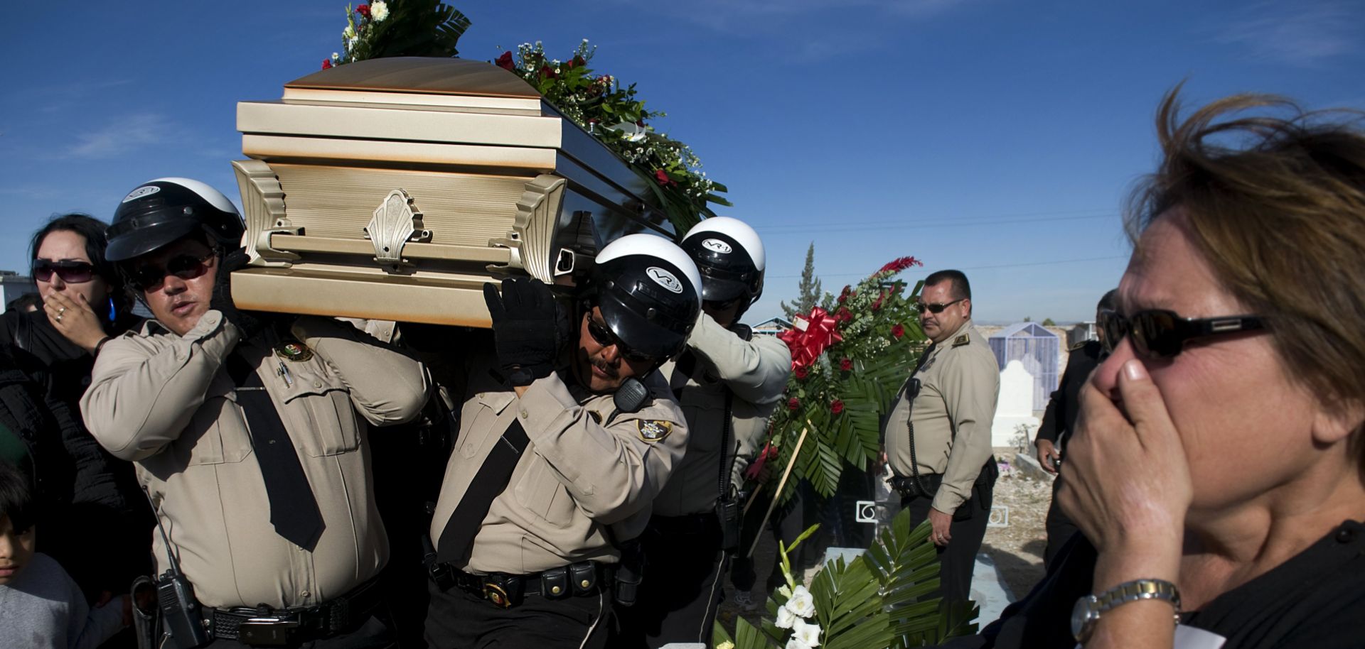 The casket of murdered police officer David Miranda Ramirez, 36, is carried by fellow police at his funeral in Juarez on Nov. 13, 2008.