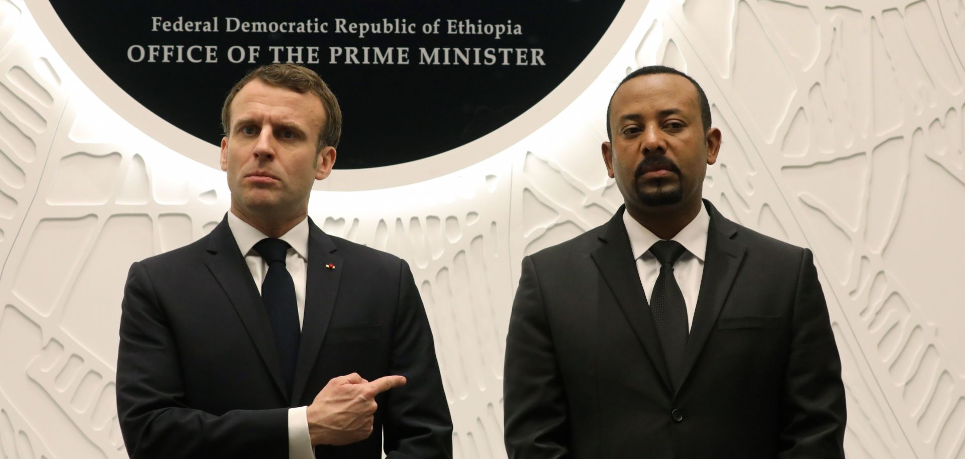 Ethiopian Prime Minister Abiy Ahmed (R) speaks with French President Emmanuel Macron after signing agreements during a meeting on March 12, 2019, in Addis Ababa.
