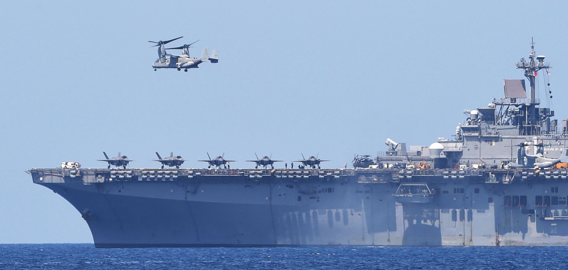 A helicopter takes off from a U.S. Navy vessel during joint U.S.-Philippines military exercises in waters facing the South China Sea on April 11, 2019. 