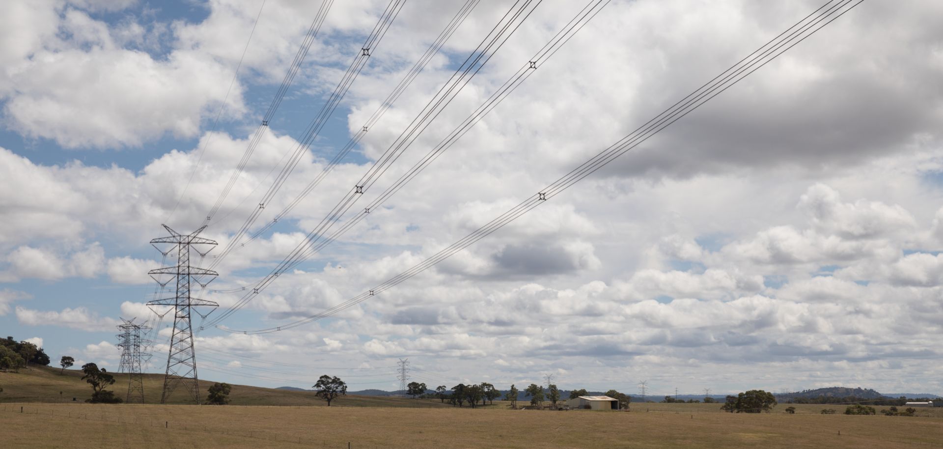 Power lines are seen in the countryside of a town in New South Wales, Australia. 