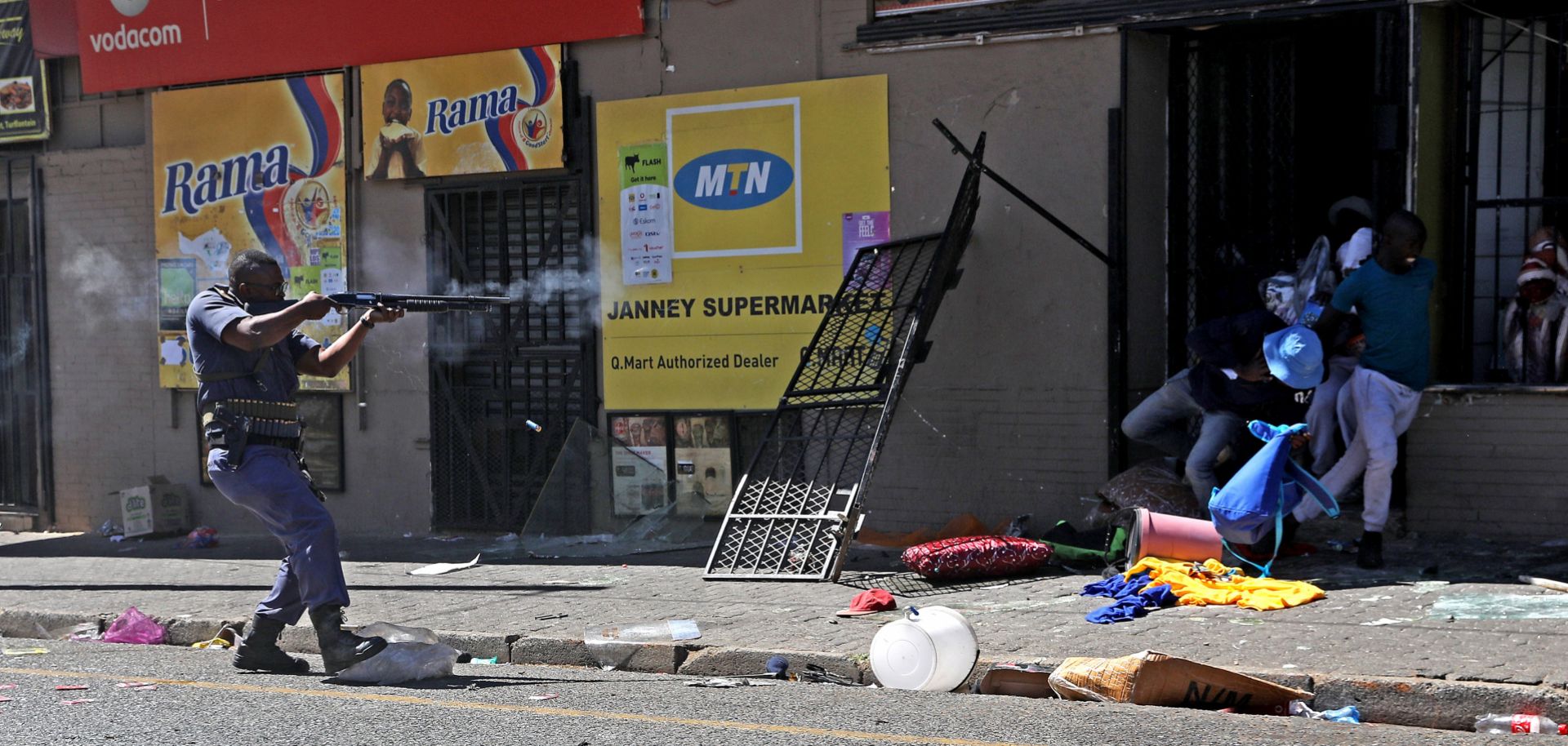 South African law enforcement officers clash with looters during xenophobic violence and looting on Sept. 2, 2019, in Johannesburg.
