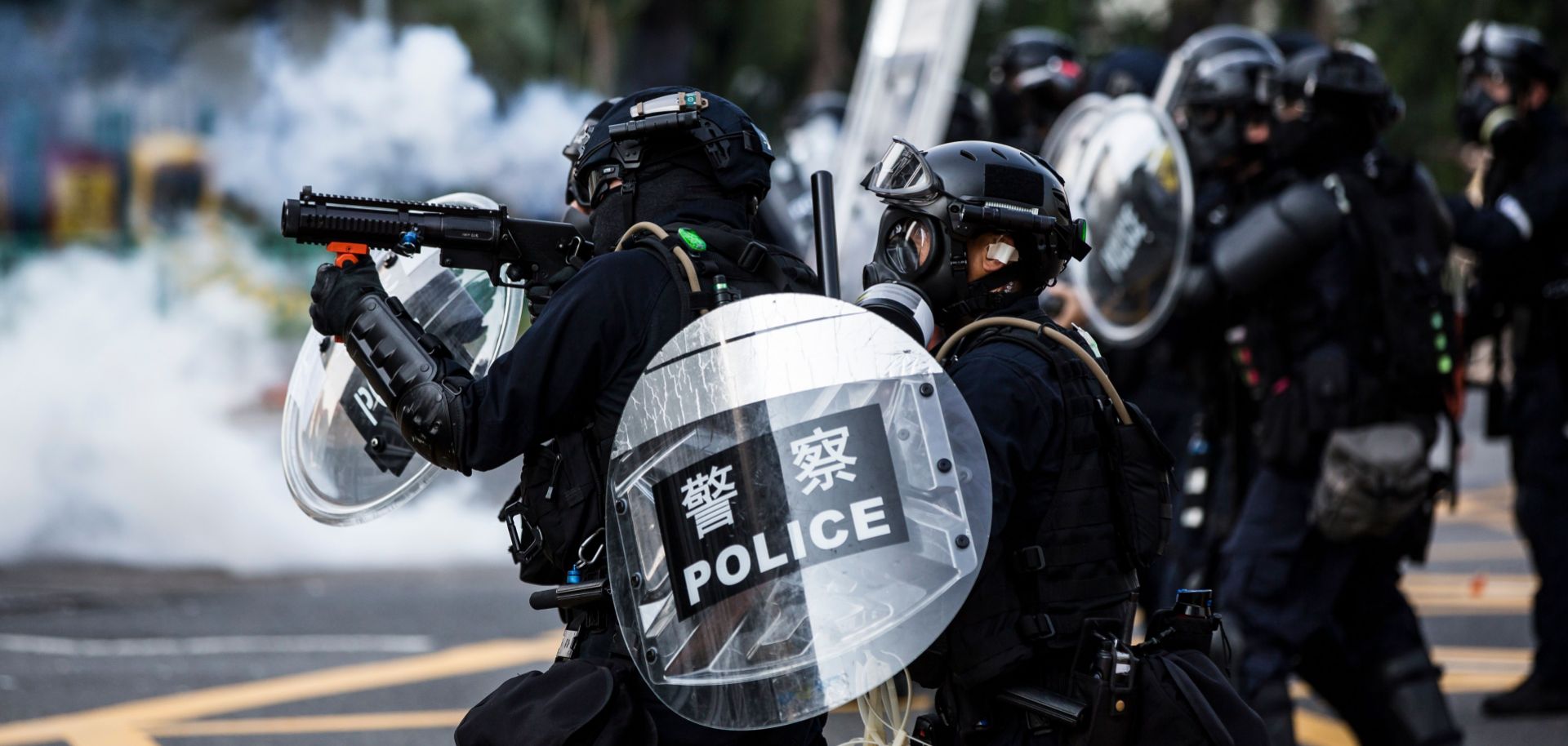 Police fire tear gas to disperse protesters in the Sha Tin district of Hong Kong on Oct. 1, 2019, as the city observes the National Day holiday marking the 70th anniversary of communist China's founding. 